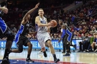 Nov 7, 2015; Philadelphia, PA, USA; Philadelphia 76ers guard Nik Stauskas (11) drives toward the net as Orlando Magic guard Elfrid Payton (4) defends during the fourth quarter of the game at the Wells Fargo Center. The Orlando Magic won 105-97. Mandatory 