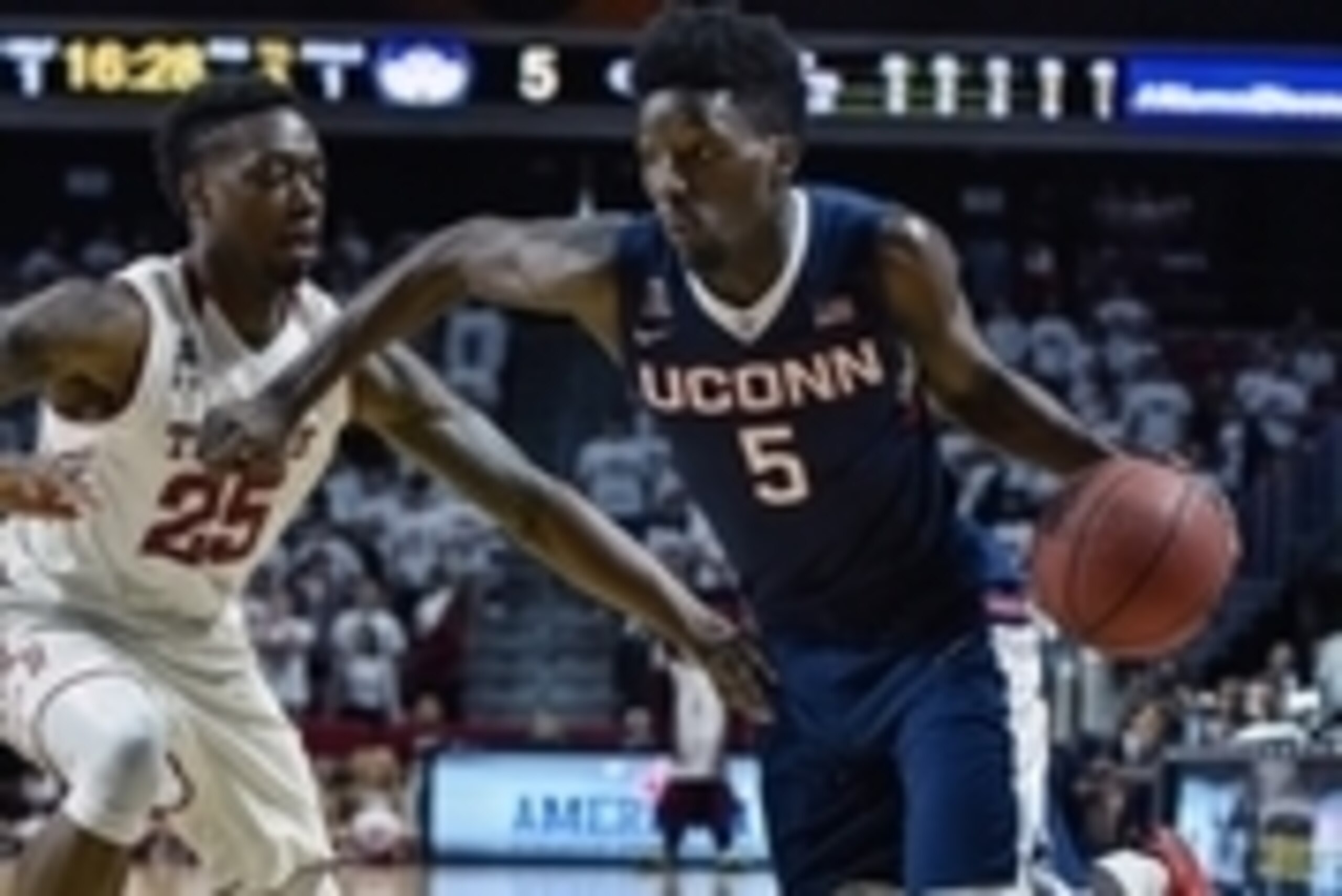 Mar 7, 2015; Philadelphia, PA, USA; Connecticut Huskies guard/forward Daniel Hamilton (5) drives toward the net during the first half of the game against the Temple Owls at the Liacouras Center. Mandatory Credit: John Geliebter-USA TODAY Sports