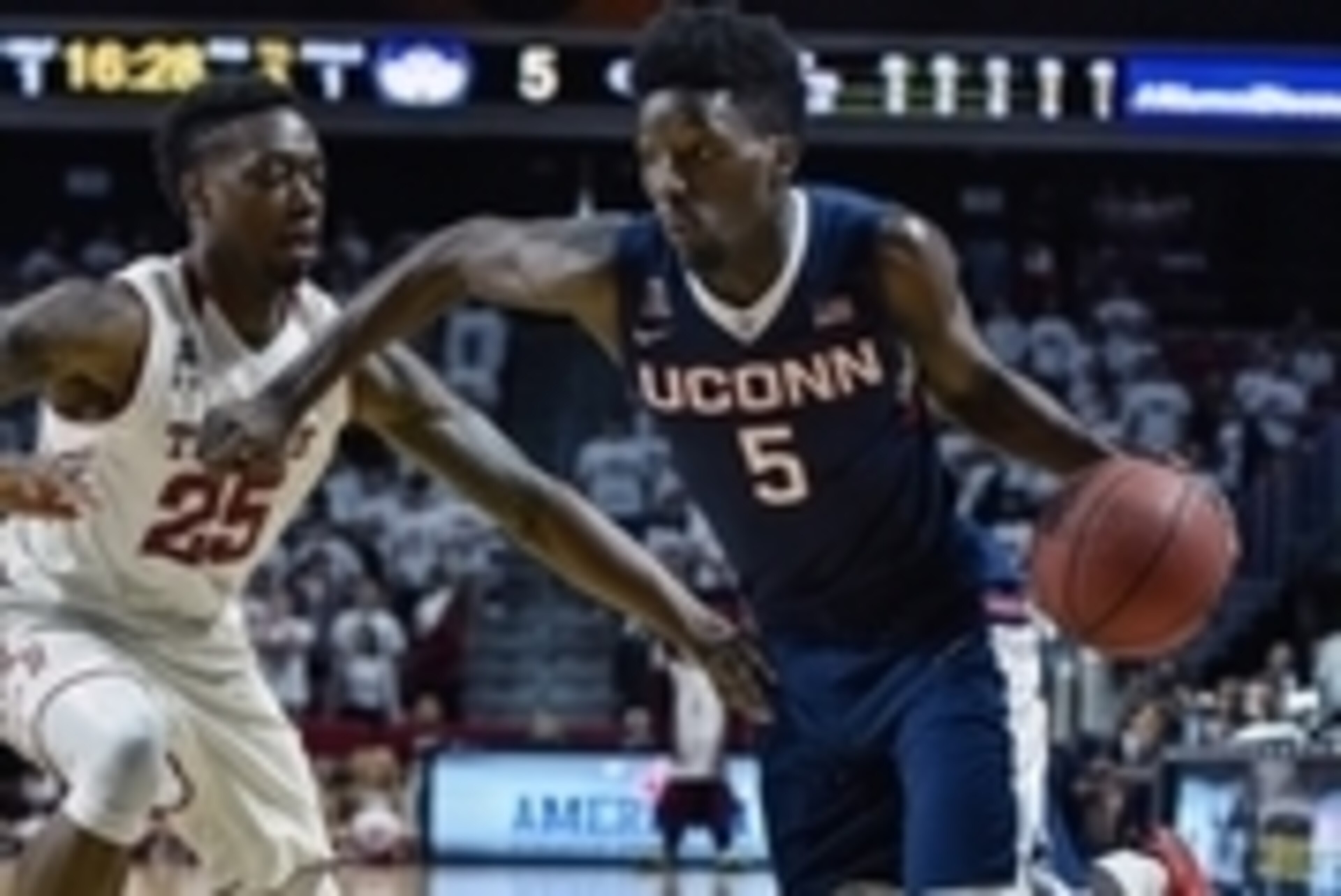 Mar 7, 2015; Philadelphia, PA, USA; Connecticut Huskies guard/forward Daniel Hamilton (5) drives toward the net during the first half of the game against the Temple Owls at the Liacouras Center. Mandatory Credit: John Geliebter-USA TODAY Sports