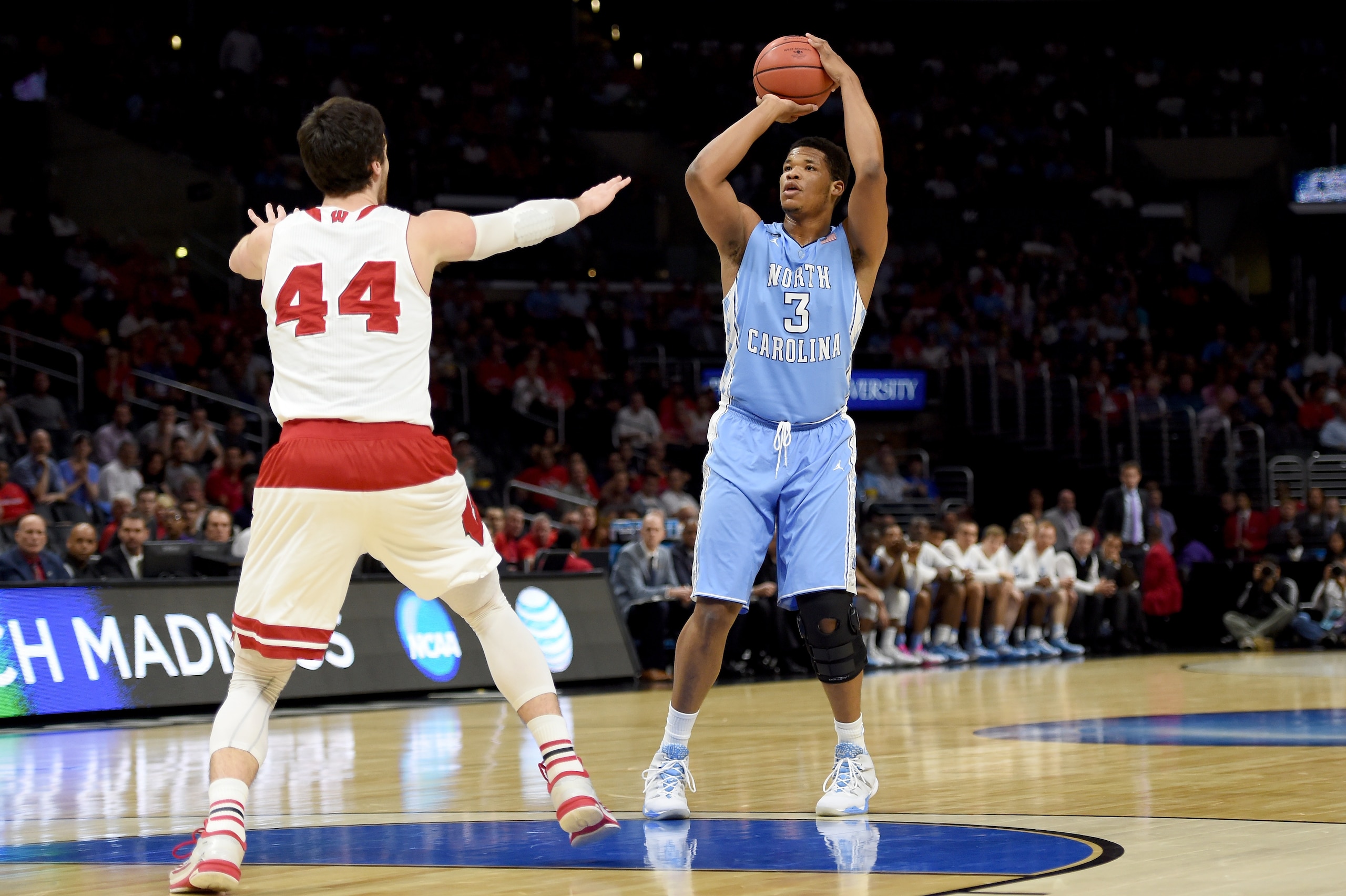 LOS ANGELES, CA - MARCH 26:  Kennedy Meeks #3 of the North Carolina Tar Heels shoots over Frank Kaminsky #44 of the Wisconsin Badgers in the first half during the West Regional Semifinal of the 2015 NCAA Men's Basketball Tournament at Staples Center on Ma