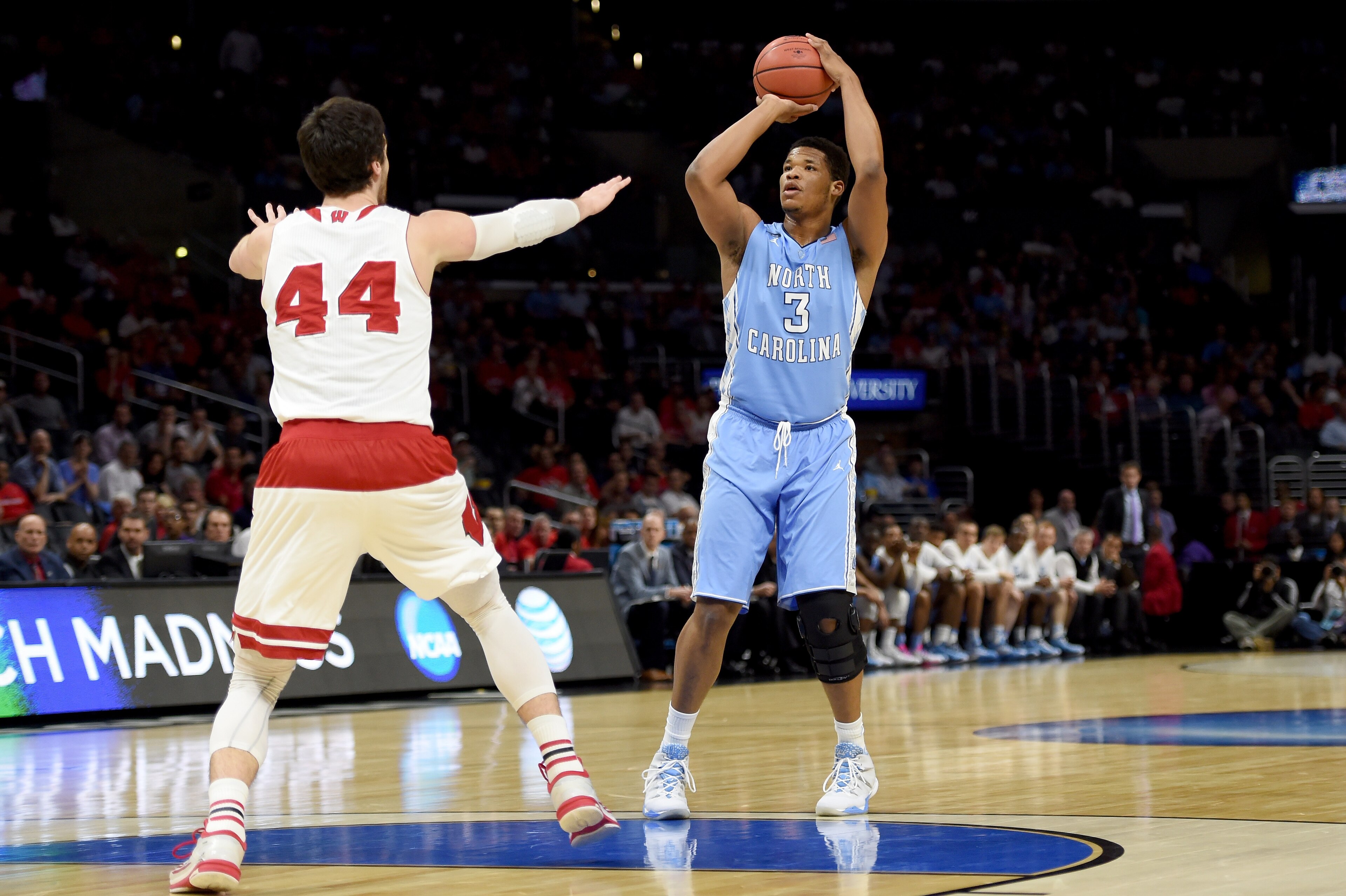 LOS ANGELES, CA - MARCH 26:  Kennedy Meeks #3 of the North Carolina Tar Heels shoots over Frank Kaminsky #44 of the Wisconsin Badgers in the first half during the West Regional Semifinal of the 2015 NCAA Men's Basketball Tournament at Staples Center on Ma