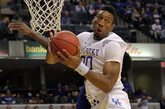 Nov 18, 2014; Indianapolis, IN, USA; Kentucky Wildcats forward Marcus Lee (00) grabs a rebound during the second half against the Kansas Jayhawks at Bankers Life Fieldhouse. Kentucky defeated Kansas 72-40. Mandatory Credit: Pat Lovell-USA TODAY Sports