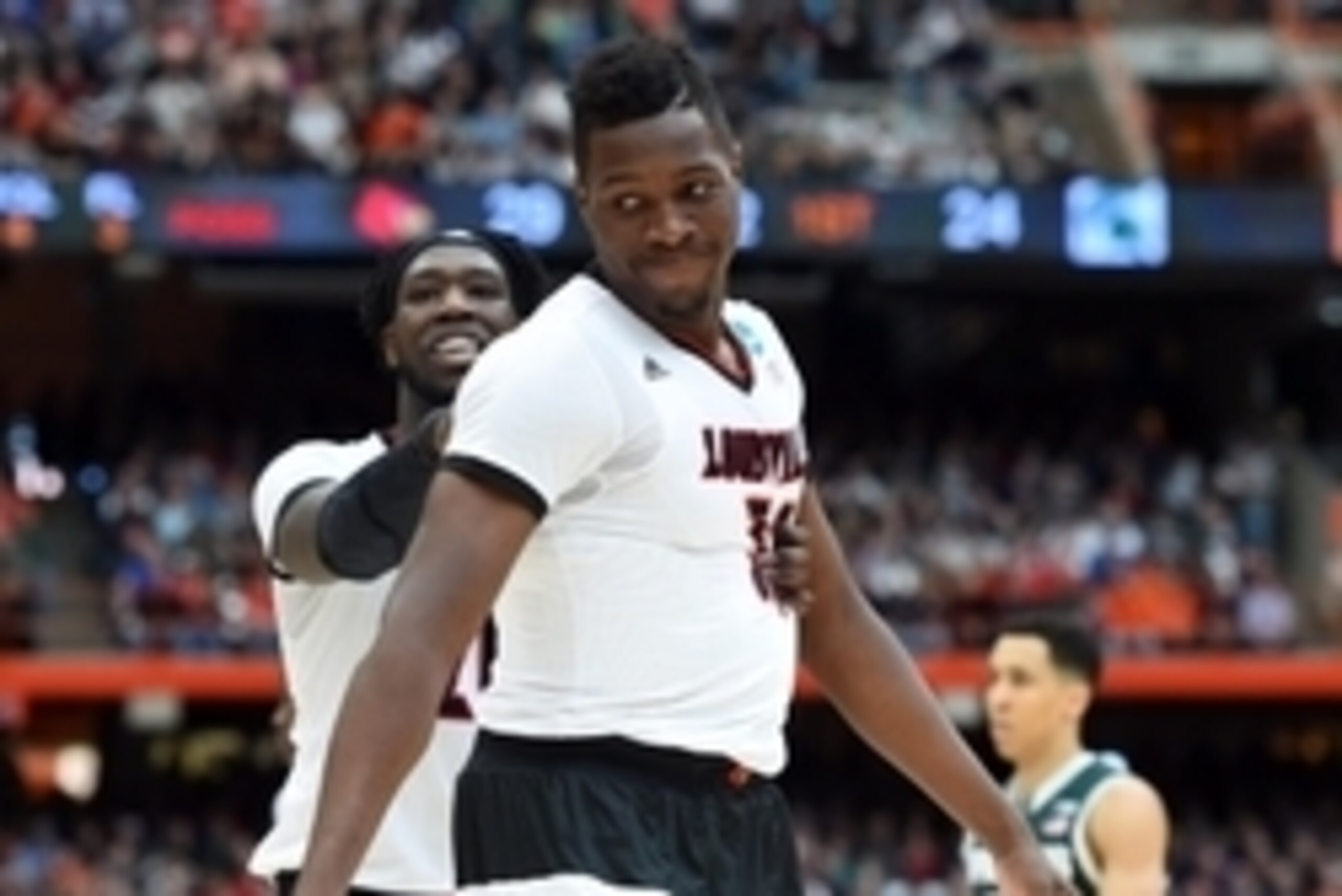Mar 29, 2015; Syracuse, NY, USA; Louisville Cardinals forward/center Chinanu Onuaku (32) reacts to a play during the first half against the Michigan State Spartans in the finals of the east regional of the 2015 NCAA Tournament at Carrier Dome. Mandatory C