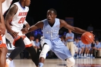 Nov 28, 2014; Paradise Island, BAHAMAS; North Carolina Tar Heels guard/forward Theo Pinson (1) dribbles as Florida Gators guard Michael Frazier II (20) defends during the first half at Imperial Arena at Atlantis Resort. Mandatory Credit: Kevin Jairaj-USA 