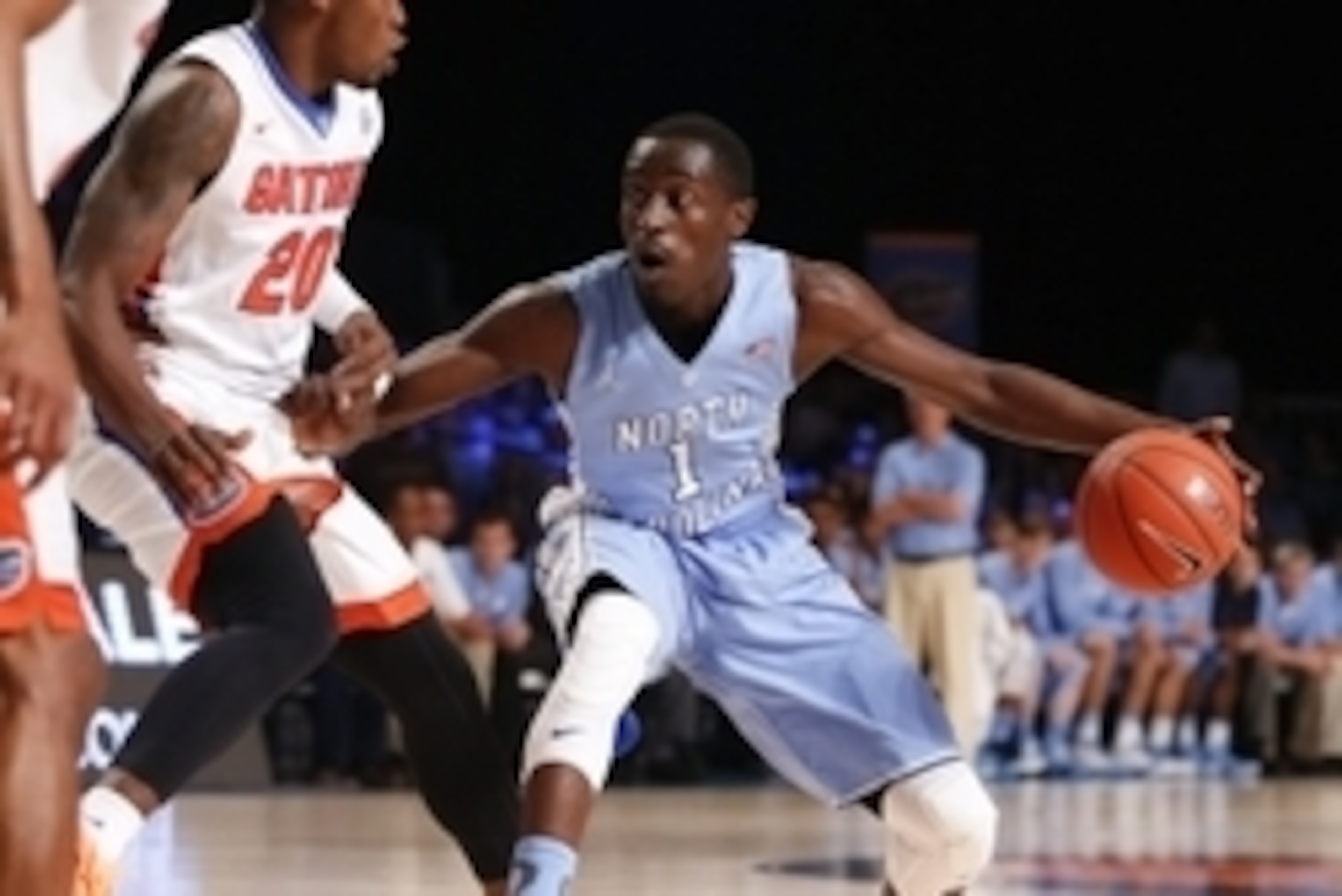 Nov 28, 2014; Paradise Island, BAHAMAS; North Carolina Tar Heels guard/forward Theo Pinson (1) dribbles as Florida Gators guard Michael Frazier II (20) defends during the first half at Imperial Arena at Atlantis Resort. Mandatory Credit: Kevin Jairaj-USA 