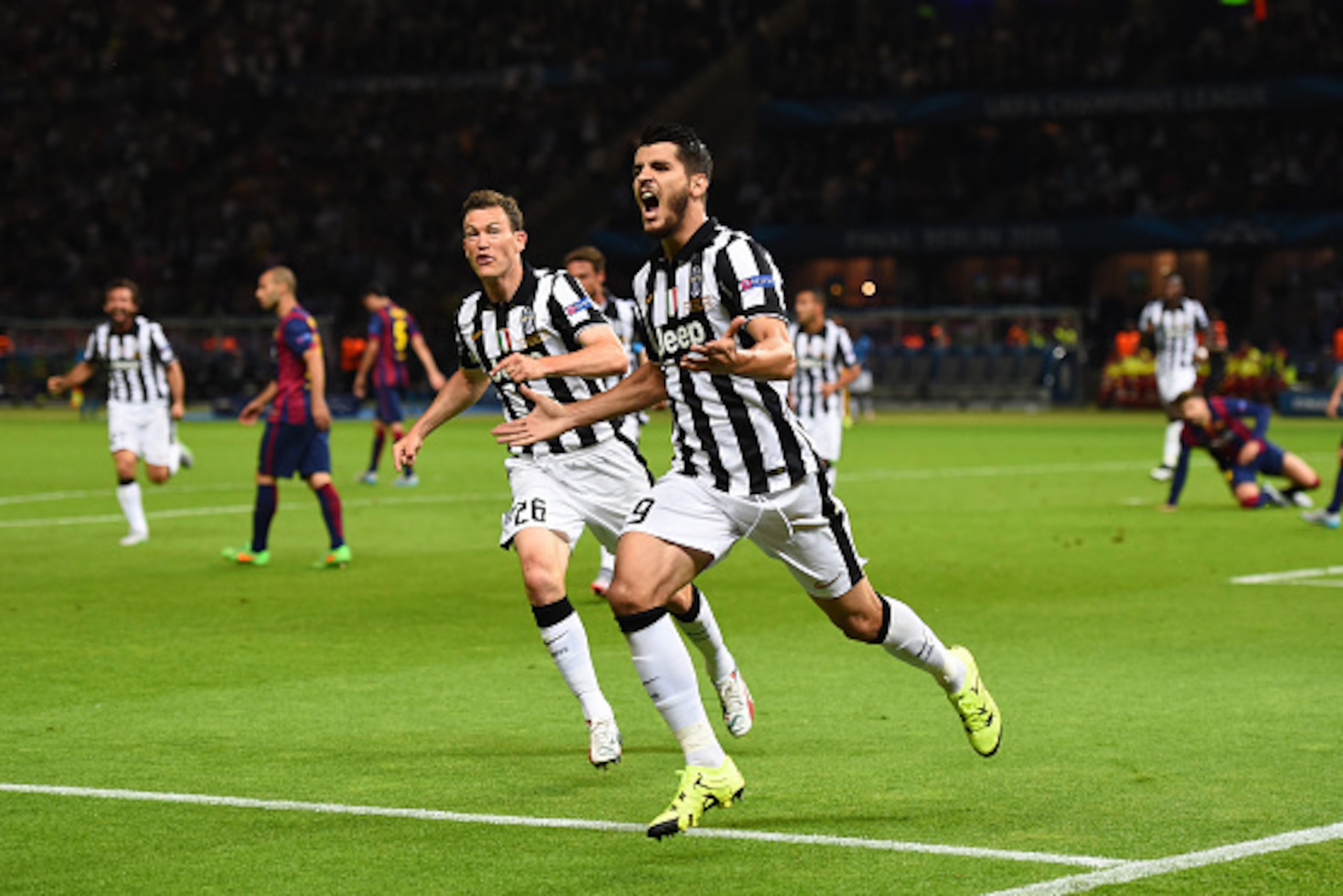 BERLIN, GERMANY - JUNE 06: Alvaro Morata of Juventus celebrates scoring his team's first goal with Stephan Lichtsteiner during the UEFA Champions League Final between Juventus and FC Barcelona at Olympiastadion on June 6, 2015 in Berlin, Germany. (Photo BERLIN, GERMANY - JUNE 06: Alvaro Morata of Juventus celebrates scoring his team's first goal with Stephan Lichtsteiner during the UEFA Champions League Final between Juventus and FC Barcelona at Olympiastadion on June 6, 2015 in Berlin, Germany. (Photo