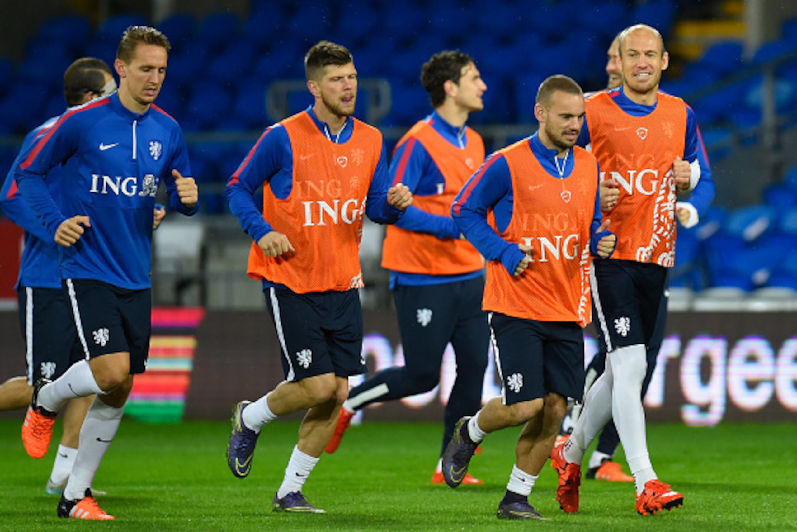 CARDIFF, WALES - NOVEMBER 12:  Netherlands player Arjen Robben (r) shares a joke with Wesley Sneijder (2nd r) during the Netherlands training session ahead of their friendly international against Wales at Cardiff City Stadium on November 12, 2015 in Cardi