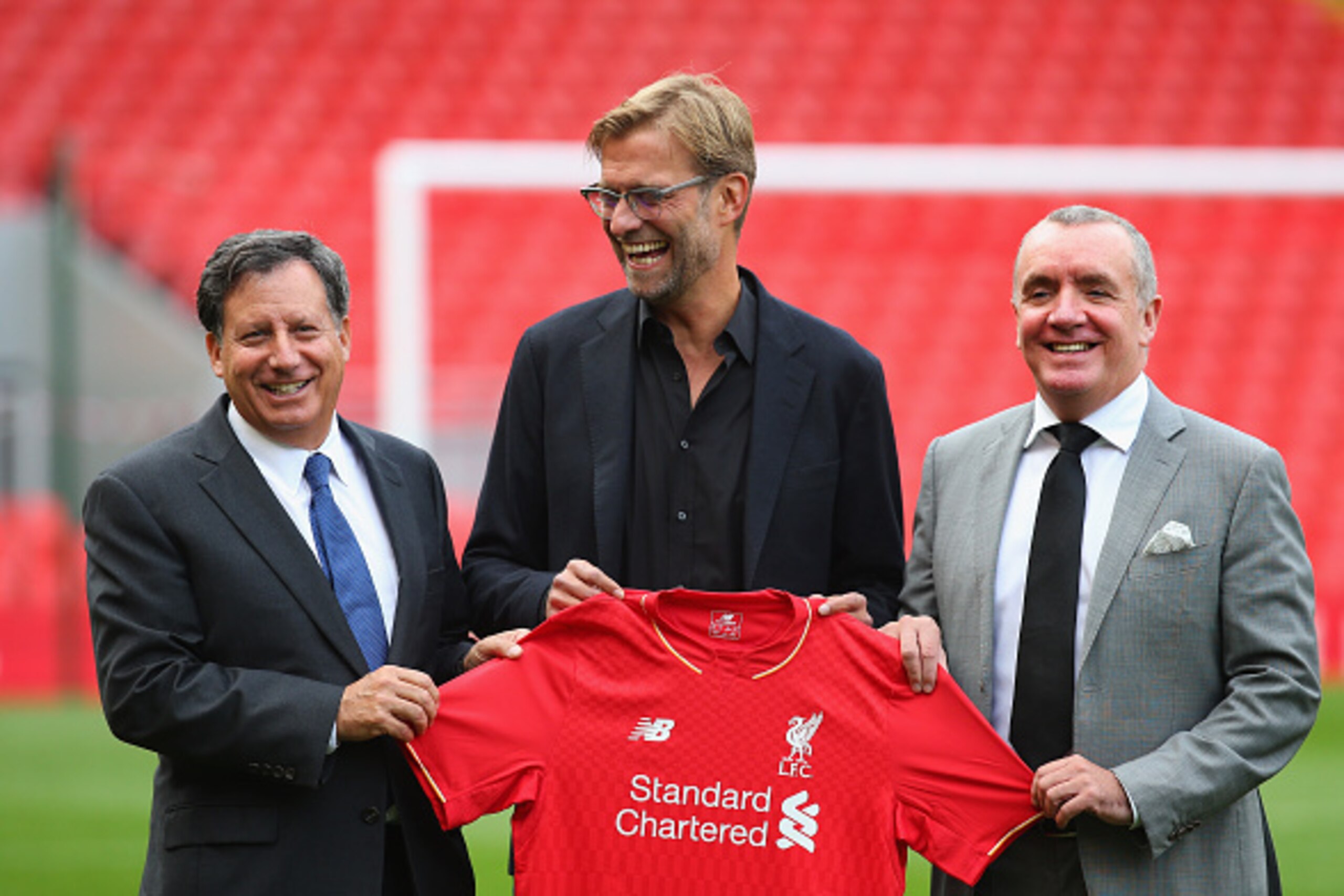 LIVERPOOL, ENGLAND - OCTOBER 09:  Jurgen Klopp is unveiled as the new manager of Liverpool FC as he stands alongside Tom Werner (l) the chairman and Ian Ayre (r) the chief executive during a photocall at Anfield on October 9, 2015 in Liverpool, England.  