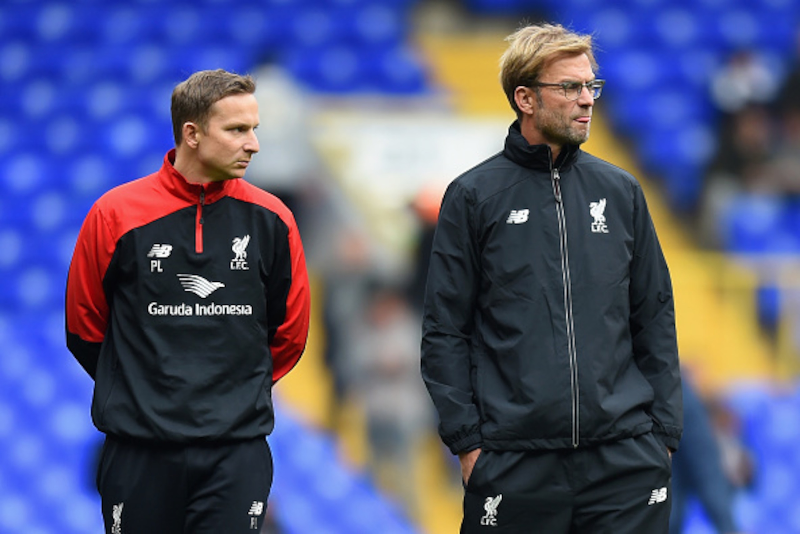 LONDON, ENGLAND - OCTOBER 17:  Jurgen Klopp (R), manager of Liverpool and First-team development coach Pepijn Lijnders (L) look on during the warm-up prior to the Barclays Premier League match between Tottenham Hotspur and Liverpool at White Hart Lane on 