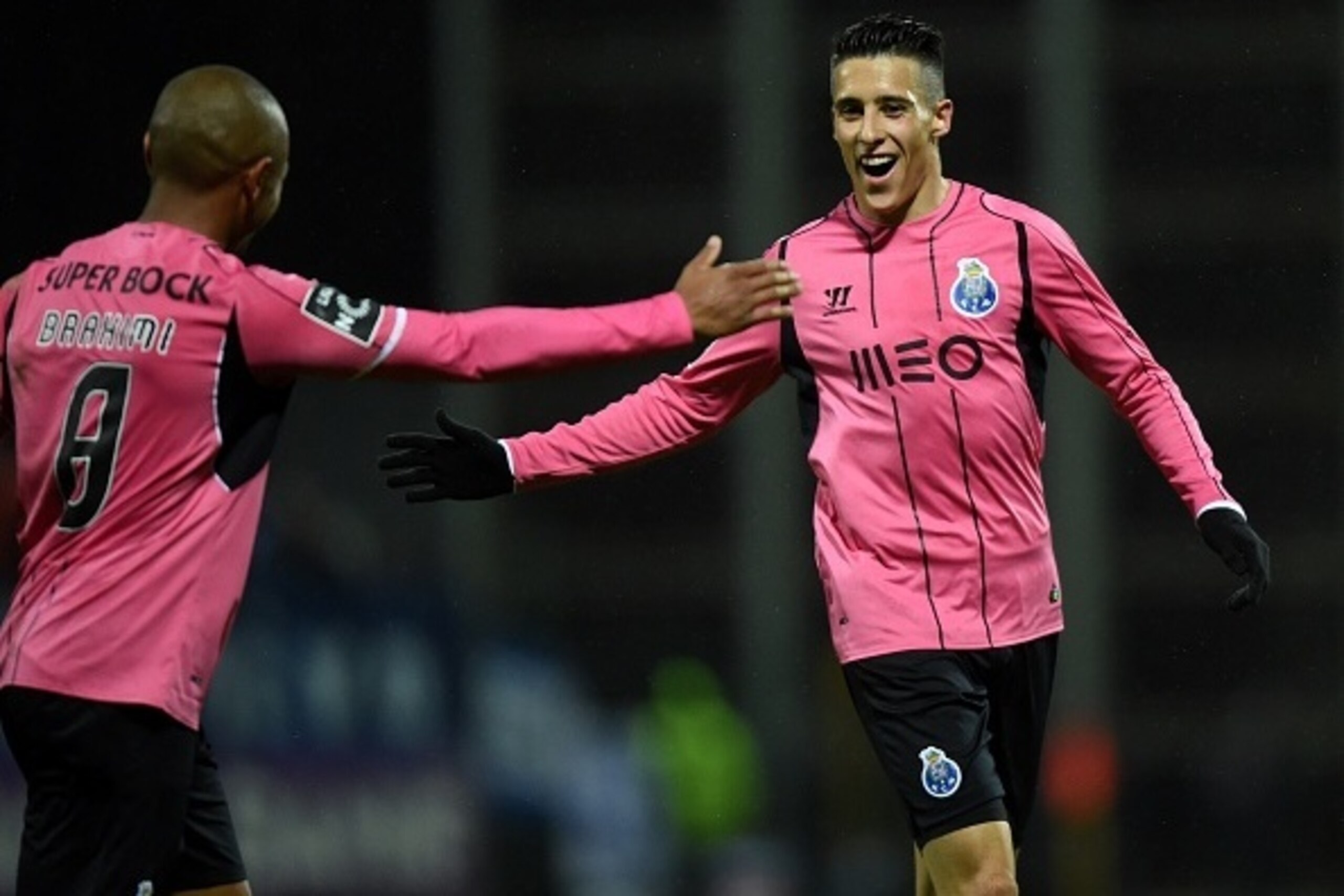 Porto's Spanish forward Cristian Tello (R) celebrates after scoring a goal during the Portuguese league football match CD Nacional vd FC Porto at the Madeira stadium in Funchal on March 21, 2015. AFP PHOTO / FRANCISCO LEONG (Photo credit should r Porto's Spanish forward Cristian Tello (R) celebrates after scoring a goal during the Portuguese league football match CD Nacional vd FC Porto at the Madeira stadium in Funchal on March 21, 2015. AFP PHOTO / FRANCISCO LEONG (Photo credit should r