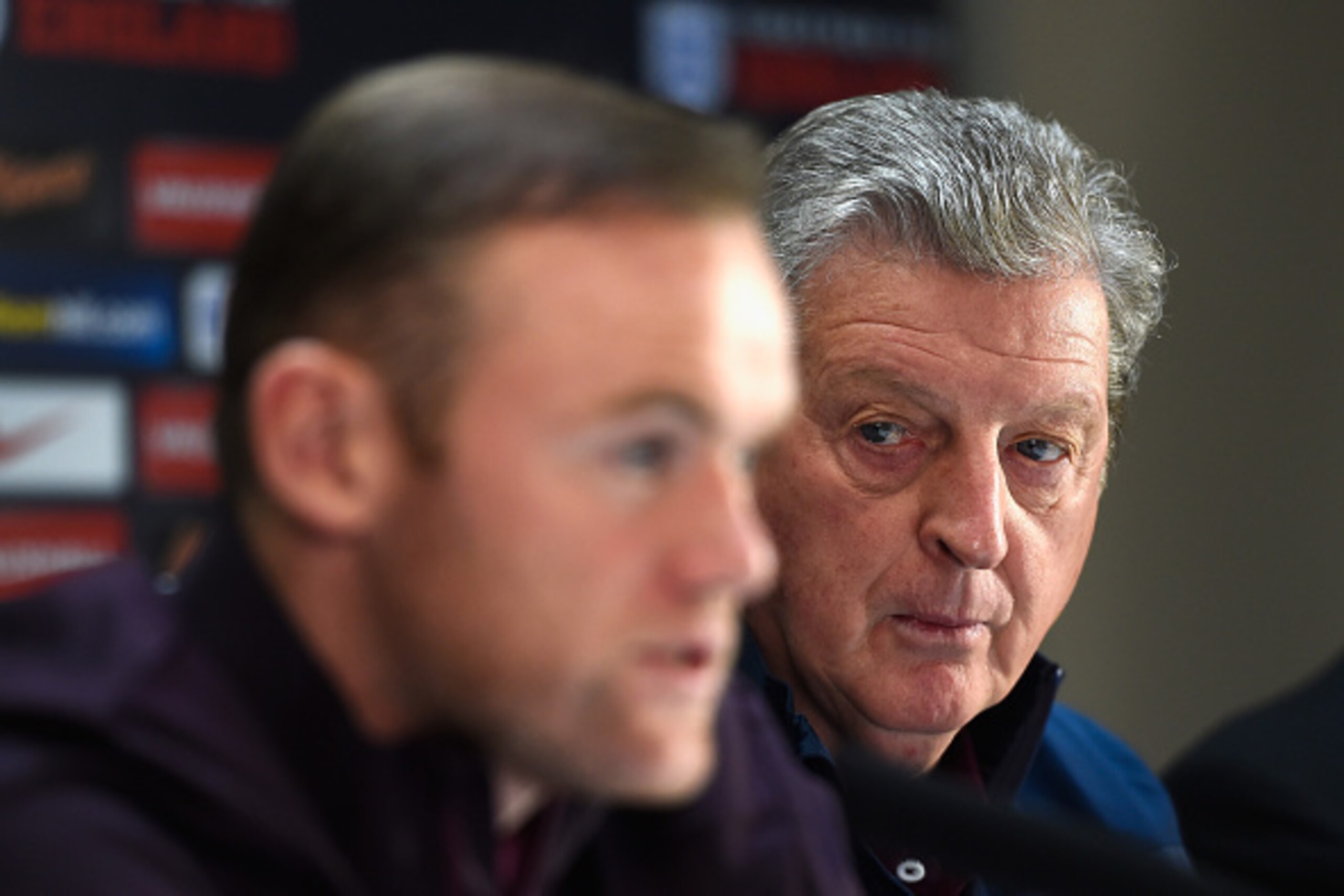 ALICANTE, SPAIN - NOVEMBER 12:  England manager Roy Hodgson looks on as England captain Wayne Rooney faces the media during an England press conference at the Asia Gardens hotel on November 12, 2015 in Alicante, Spain.  (Photo by Mike Hewitt/Getty Images)