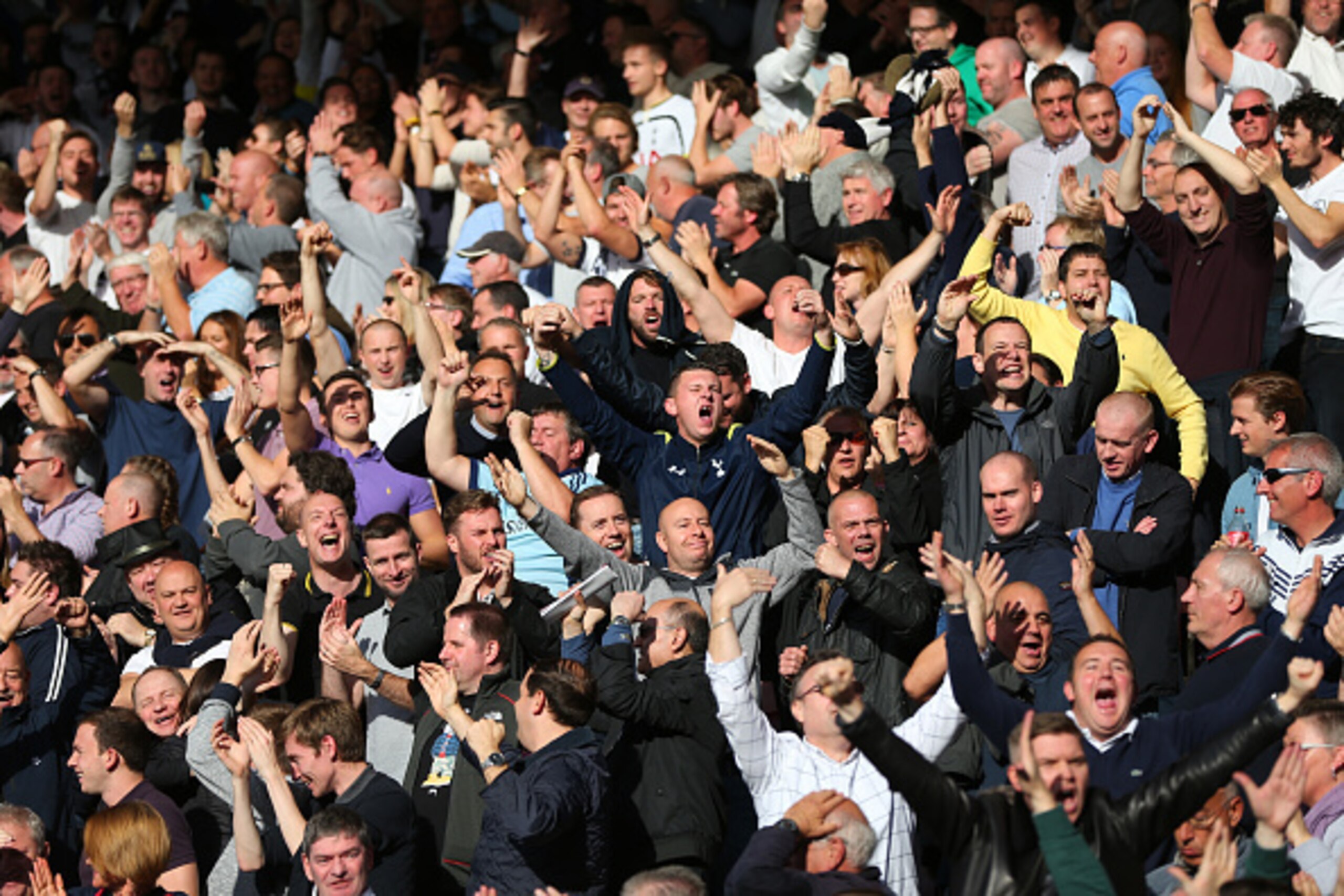 BOURNEMOUTH, ENGLAND - OCTOBER 25:  Tottenham Hotspur fans celebrate during the Barclays Premier League match between A.F.C Bournemouth and Tottenham Hotspur at Vitality Stadium on October 25, 2015 in Bournemouth, England.  (Photo by Catherine Ivill - AMA