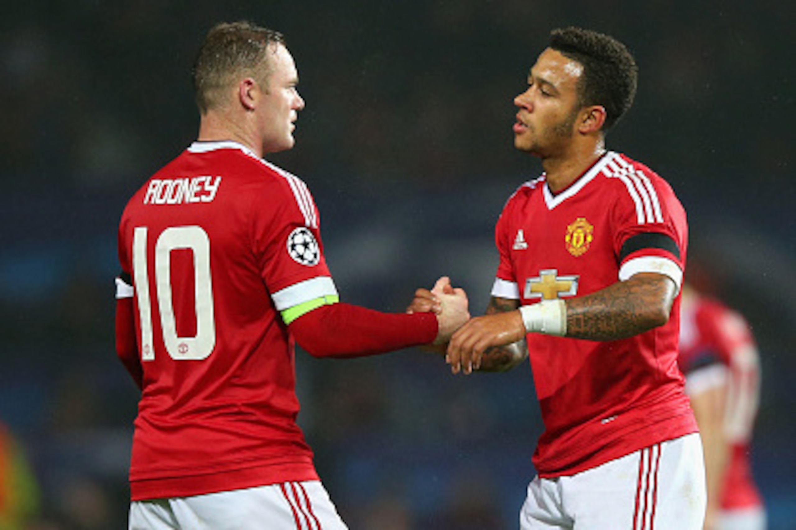 MANCHESTER, ENGLAND - NOVEMBER 03:  Wayne Rooney and Memphis Depay of Manchester United embrace at the final whistle during the UEFA Champions League Group B match between Manchester United FC and PFC CSKA Moskva at Old Trafford on November 3, 2015 in Man