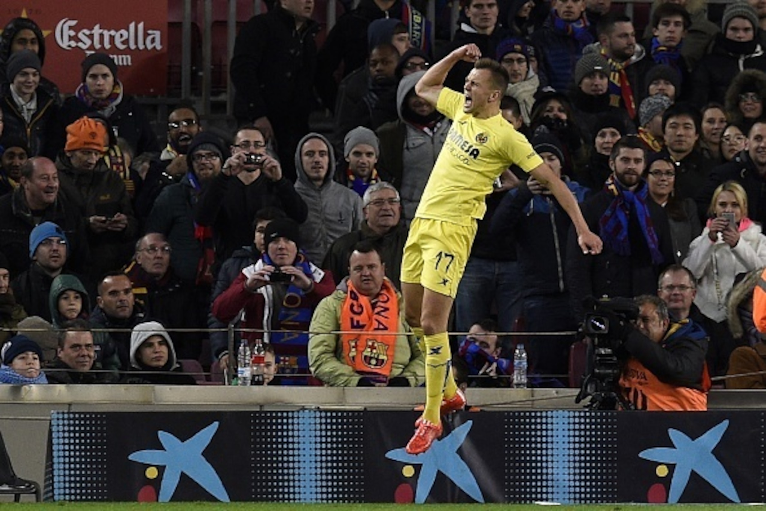 Villarreal's Russian midfielder Denis Cheryshev celebrates after scoring a goal during the Spanish league football match FC Barcelona vs Villarreal CF at the Camp Nou stadium in Barcelona on February 1, 2015.  AFP PHOTO / LLUIS GENE        (Photo credit s