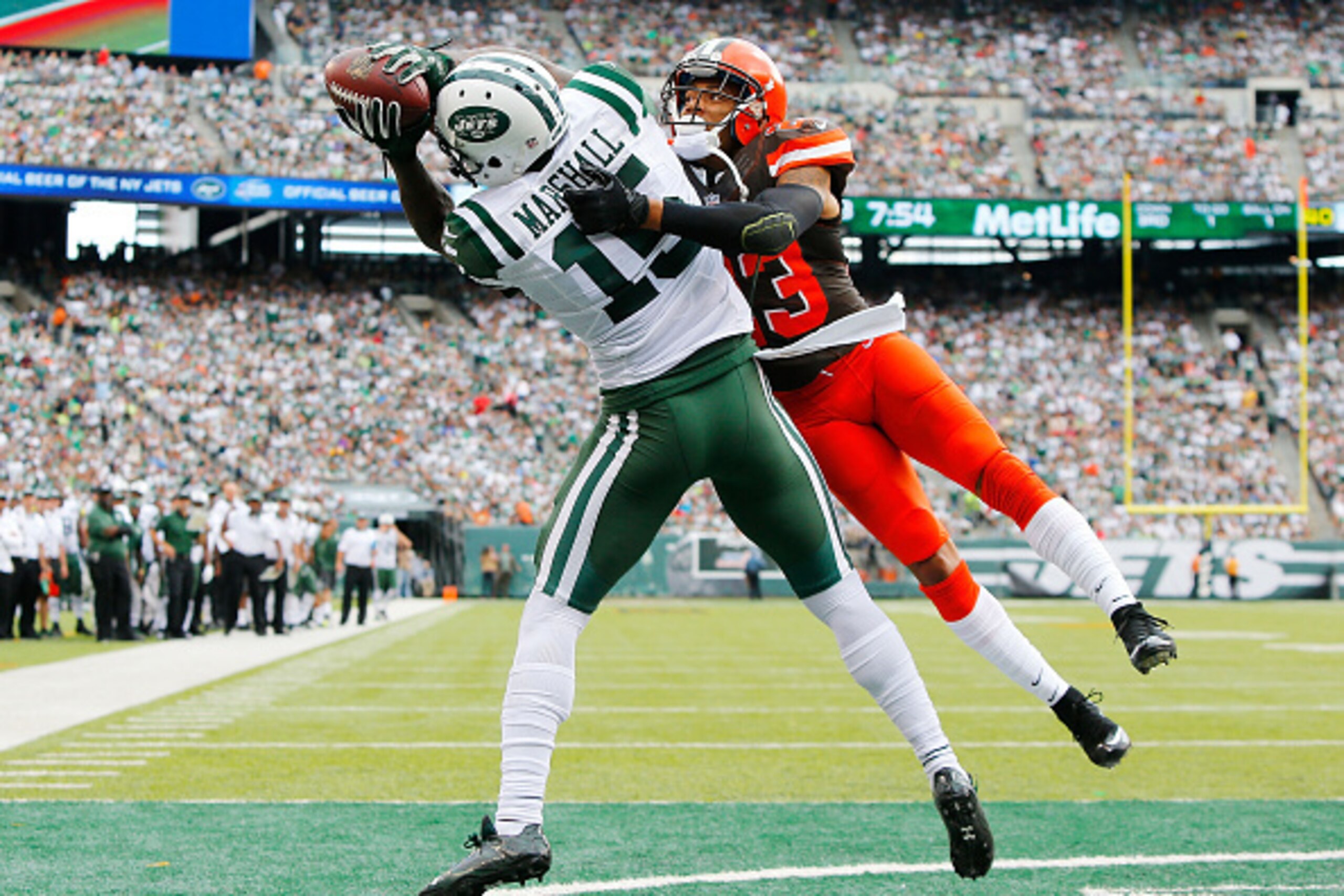 EAST RUTHERFORD, NJ - SEPTEMBER 13:  (NEW YORK DAILIES OUT)     Brandon Marshall #15 of the New York Jets hauls in a third quarter touchdown pass against Joe Haden #23 of the Cleveland Browns on September 13, 2015 at MetLife Stadium in East Rutherford, Ne