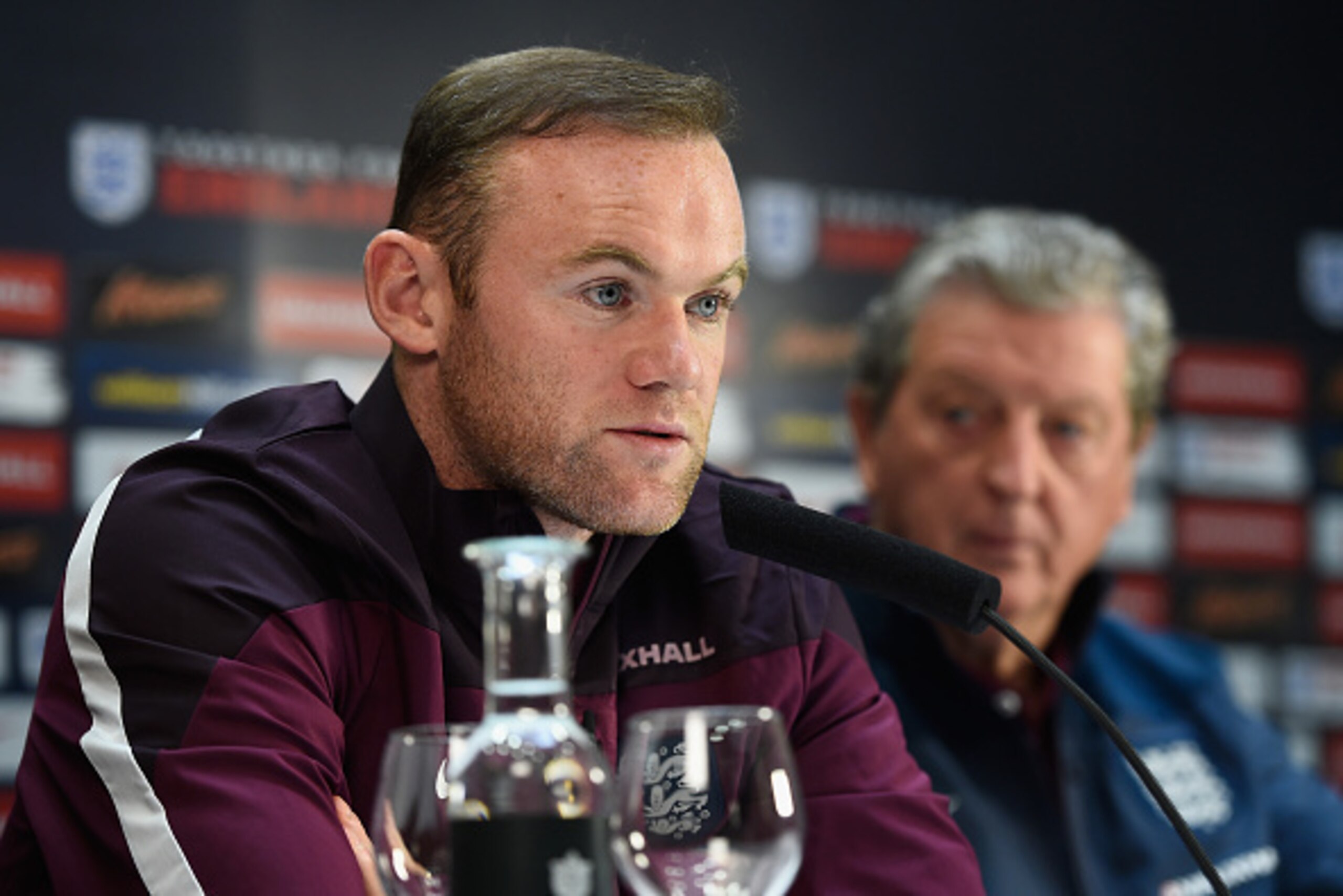 ALICANTE, SPAIN - NOVEMBER 12:  England manager Roy Hodgson looks on as England captain Wayne Rooney faces the media during an England press conference at the Asia Gardens hotel on November 12, 2015 in Alicante, Spain.  (Photo by Mike Hewitt/Getty Images)