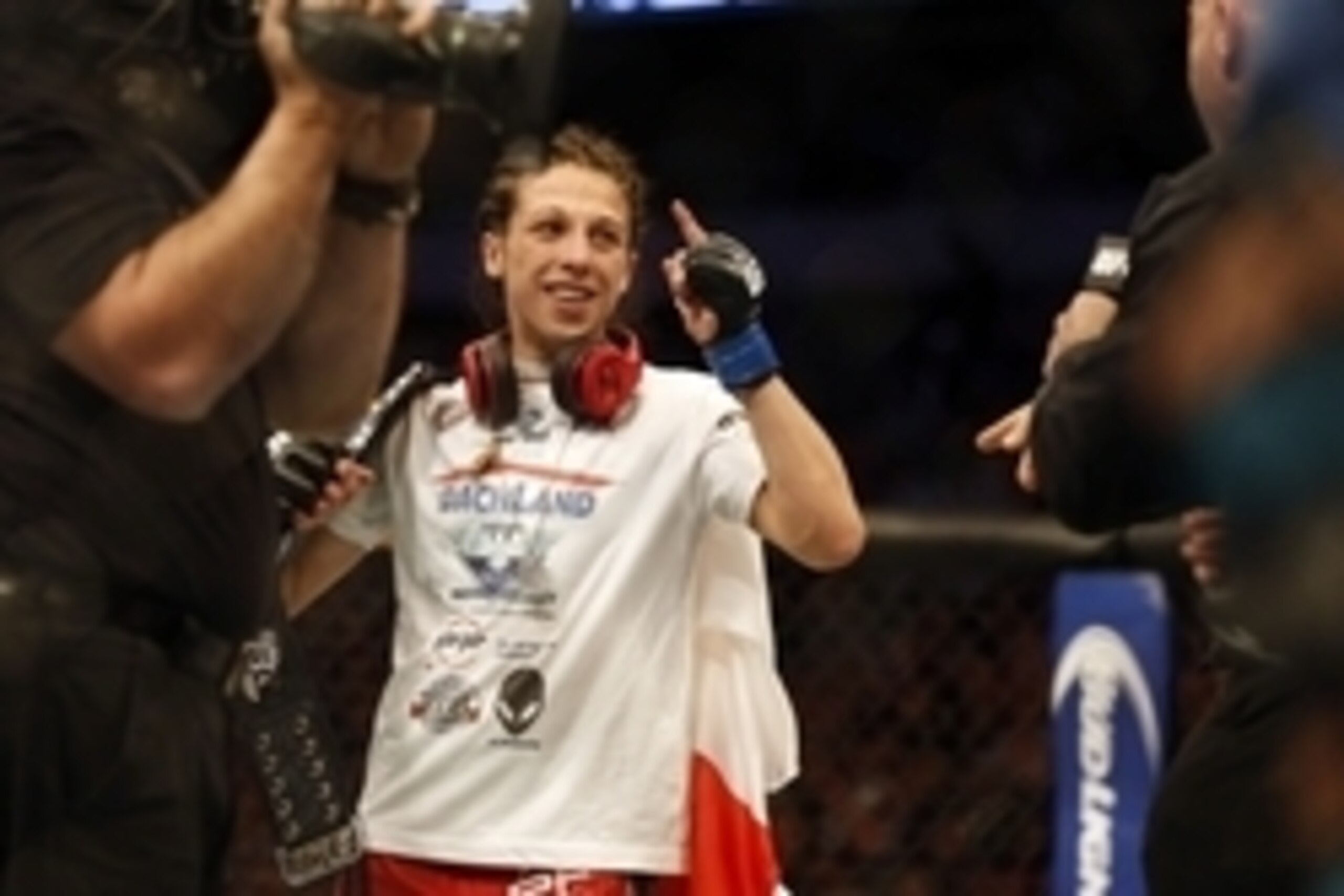 Mar 14, 2015; Dallas, TX, USA;  Joanna Jedrzejczyk (blue) celebrates defeating Carla Esparza (red) in the women's strawweight title bout during UFC 185 at American Airlines Center. Mandatory Credit: Tim Heitman-USA TODAY Sports