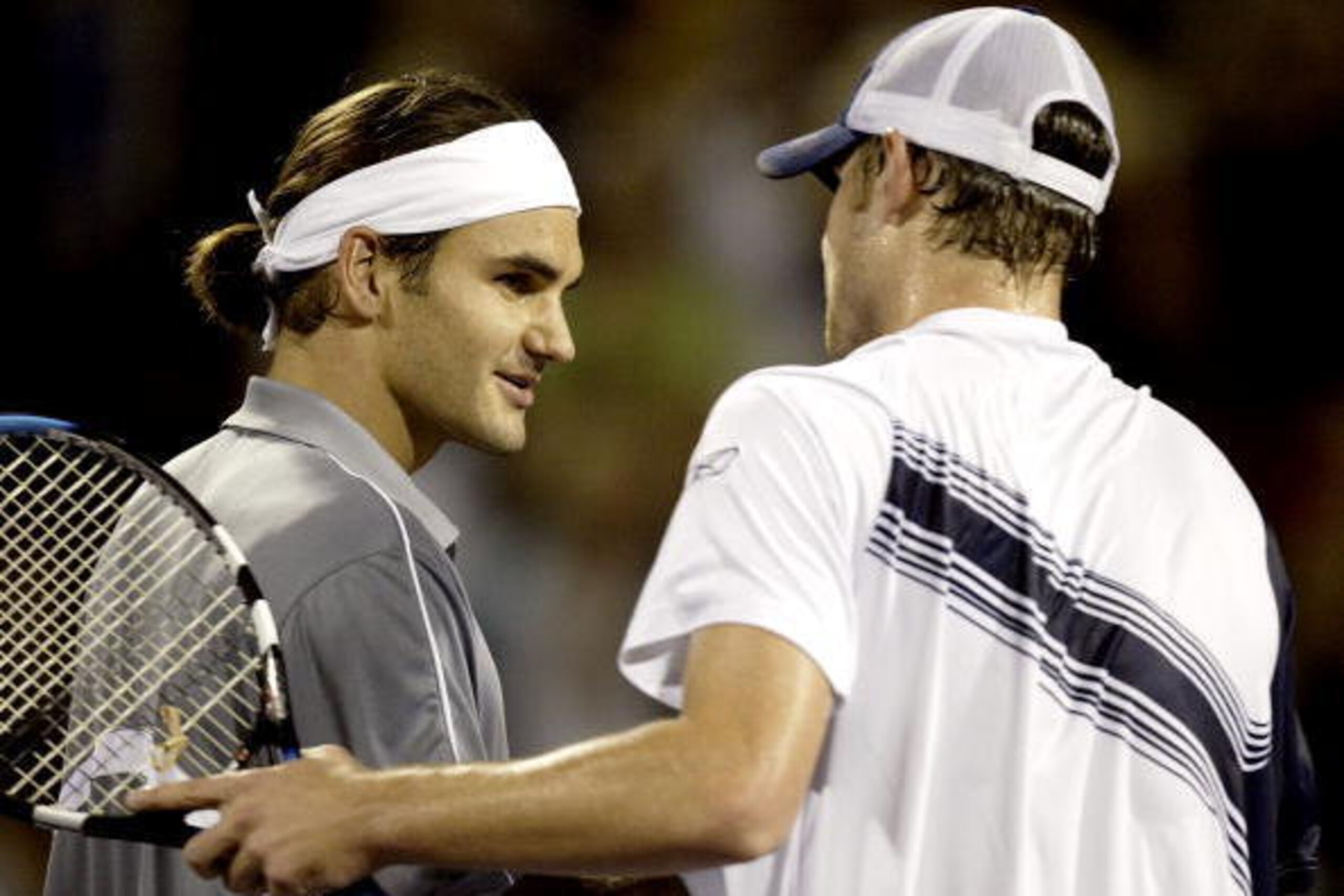 HOUSTON - NOVEMBER 15: Roger Federer of Switzerland is congratulated by Andy Roddick after their match during the Tennis Masters Cup November 15, 2003 at the Westside Tennis Club in Houston, Texas. (Photo by Matthew Stockman/Getty Images) HOUSTON - NOVEMBER 15: Roger Federer of Switzerland is congratulated by Andy Roddick after their match during the Tennis Masters Cup November 15, 2003 at the Westside Tennis Club in Houston, Texas. (Photo by Matthew Stockman/Getty Images)