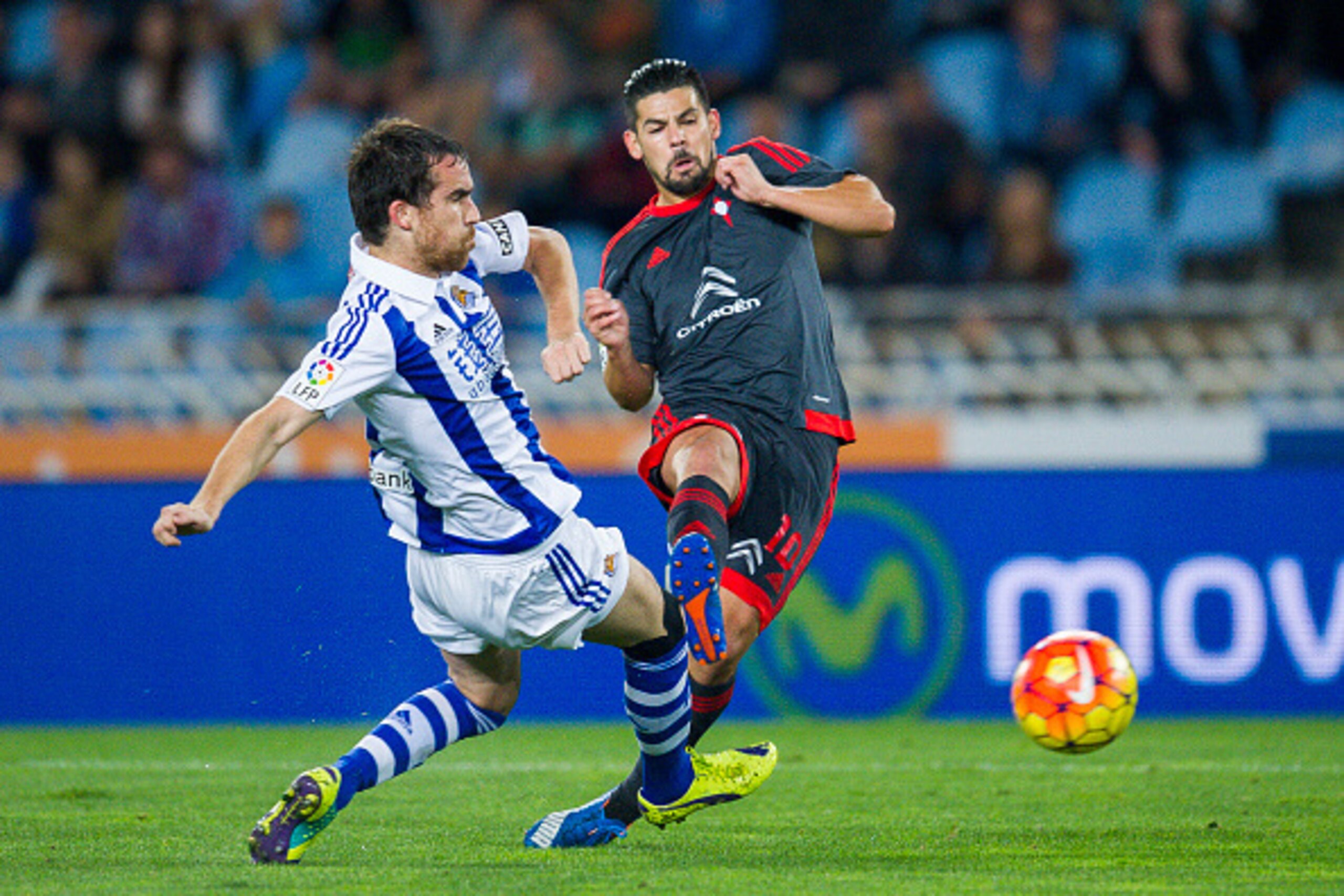SAN SEBASTIAN, SPAIN - OCTOBER 31: Nolito of Celta de Vigo duels for the ball with Mikel Gonzalez of Real Sociedad during the La Liga match between Real Sociedad de Futbol and Celta de Vigo de Futbol at Estadio Anoeta on October 31, 2015 in San Sebastian SAN SEBASTIAN, SPAIN - OCTOBER 31: Nolito of Celta de Vigo duels for the ball with Mikel Gonzalez of Real Sociedad during the La Liga match between Real Sociedad de Futbol and Celta de Vigo de Futbol at Estadio Anoeta on October 31, 2015 in San Sebastian