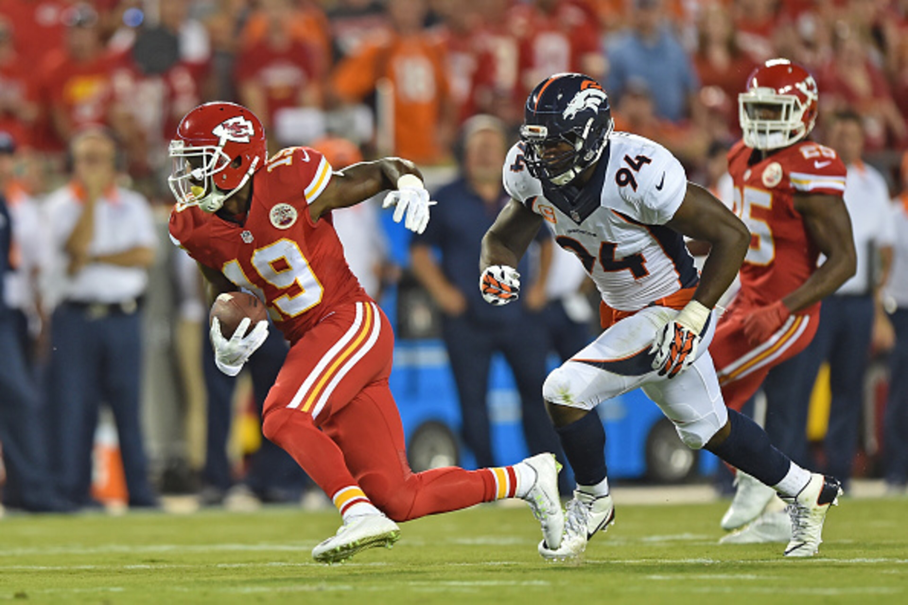 KANSAS CITY, MO - SEPTEMBER 17:  Wide receiver Jeremy Maclin #19 of the Kansas City Chiefs runs past linebacker DeMarcus Ware #94 of the Denver Broncos during the first half at Arrowhead Stadium on September 17, 2015 in Kansas City, Missouri.  (Photo by P