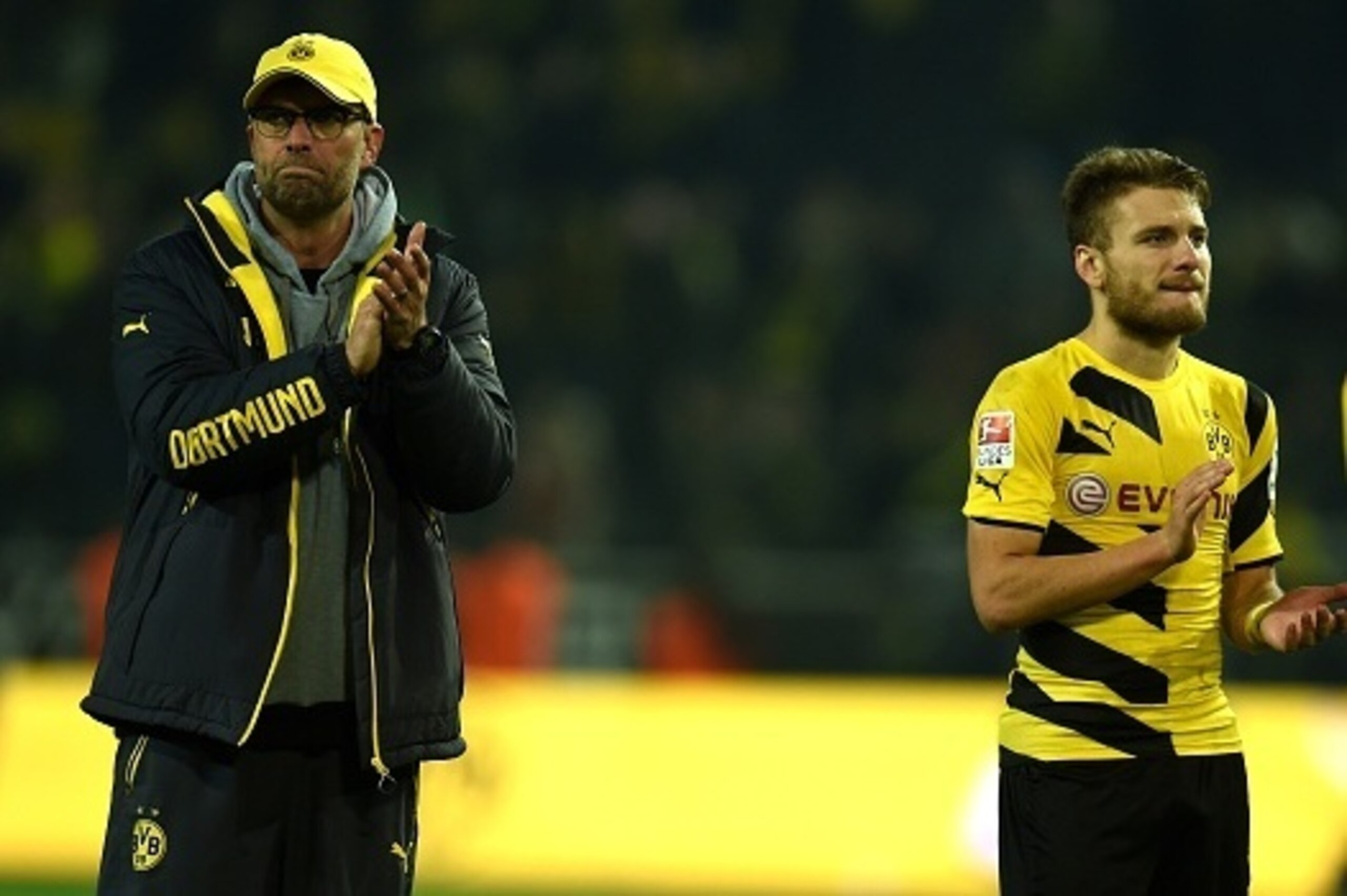 Dortmund's head coach Juergen Klopp and Dortmund's Italian striker Ciro Immobile  react after the German First division Bundesliga football match Borussia Dortmund v VfL Wolfsburg in Dortmund, Germany, on December 17, 2014.  AFP PHOTO / PATRIK STOLLARZ

R