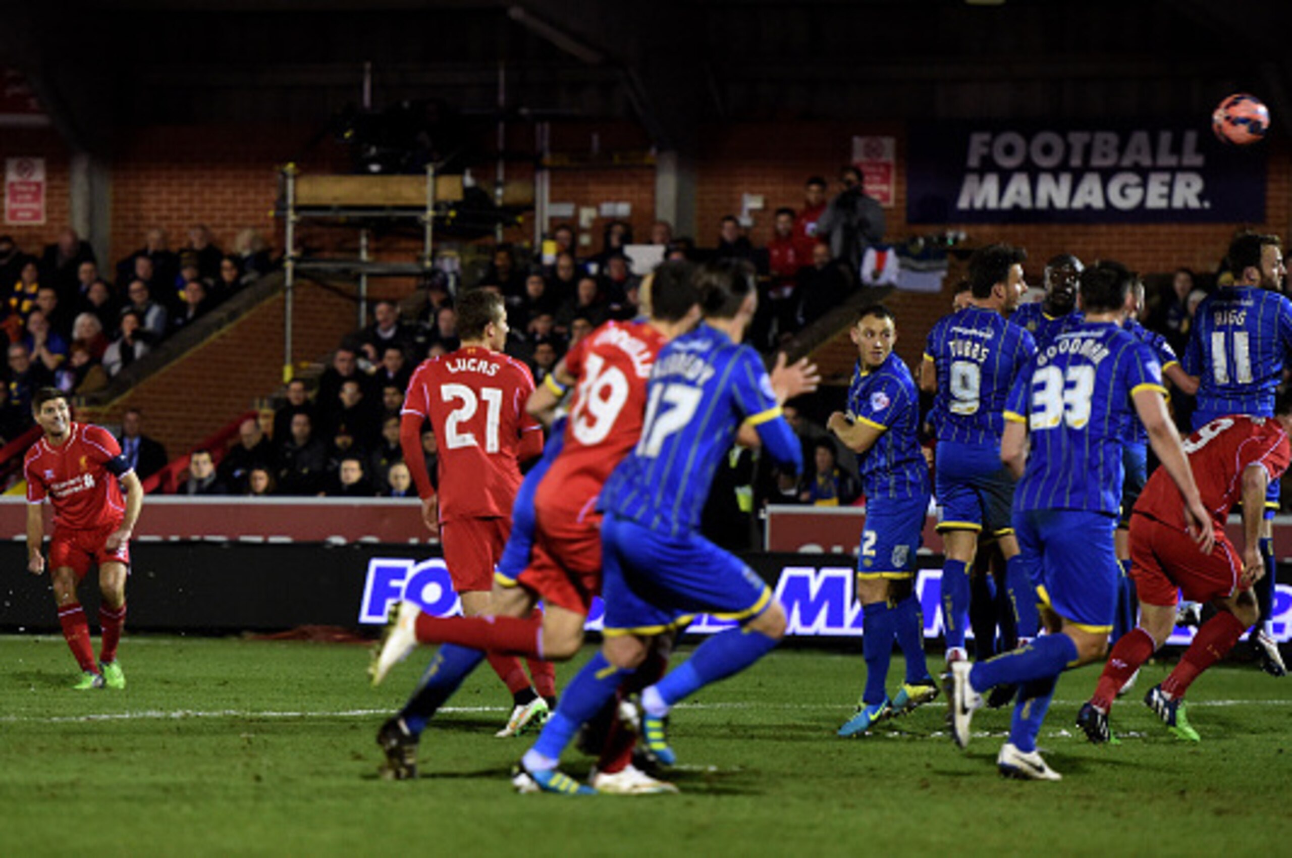 KINGSTON UPON THAMES, ENGLAND - JANUARY 05:  Steven Gerrard of Liverpool scores his team's second goal from a free kick during the FA Cup Third Round match between AFC Wimbledon and Liverpool at The Cherry Red Records Stadium on January 5, 2015 in Kingsto