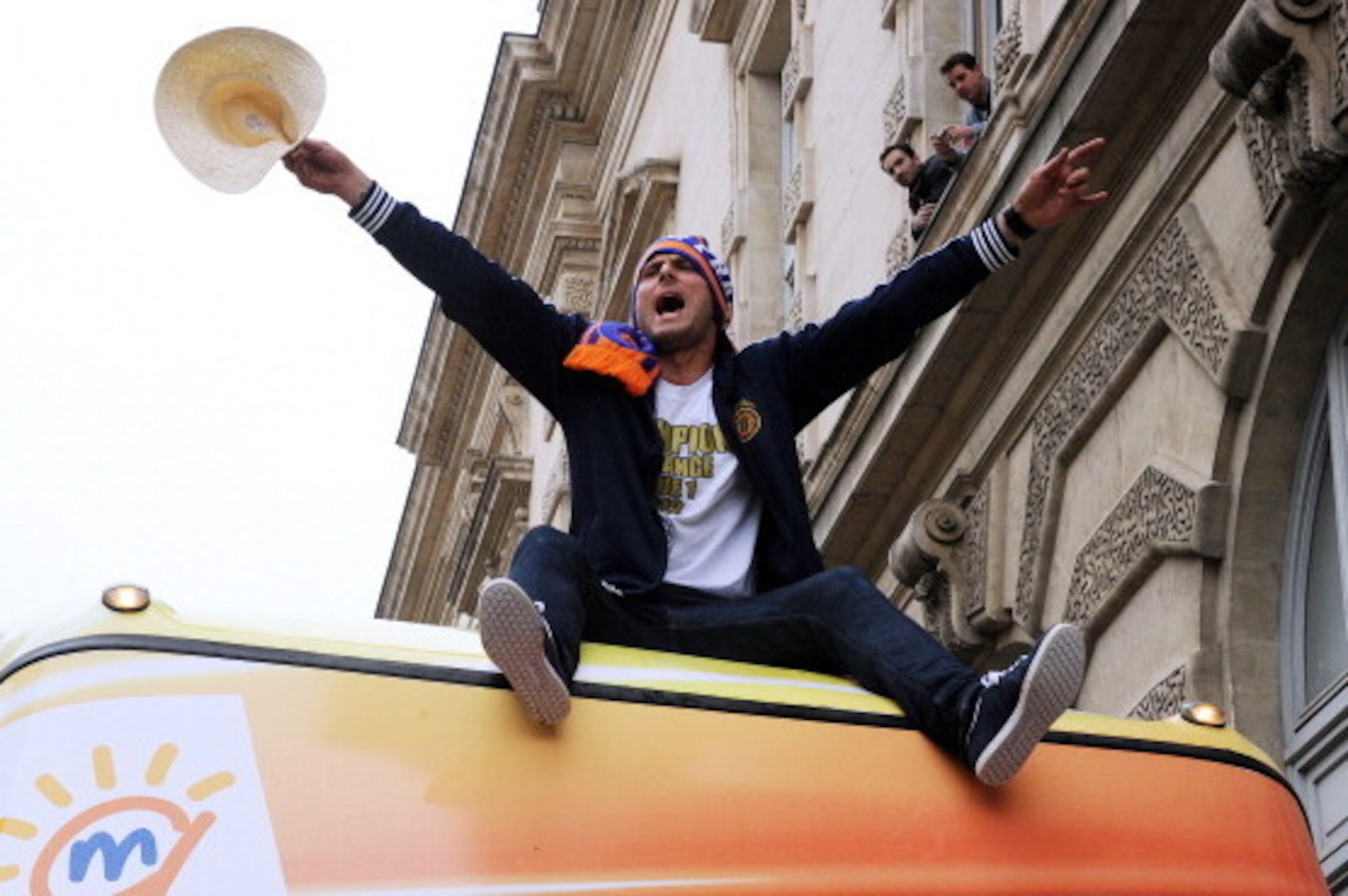 Montpellier's football club striker Olivier Giroud celebrates as the football team parade in a double decker bus at the place de la Comedie on May 21, 2012 in Montpellier, southern France, after the club won on the eve the French L1 football championship. Montpellier's football club striker Olivier Giroud celebrates as the football team parade in a double decker bus at the place de la Comedie on May 21, 2012 in Montpellier, southern France, after the club won on the eve the French L1 football championship.