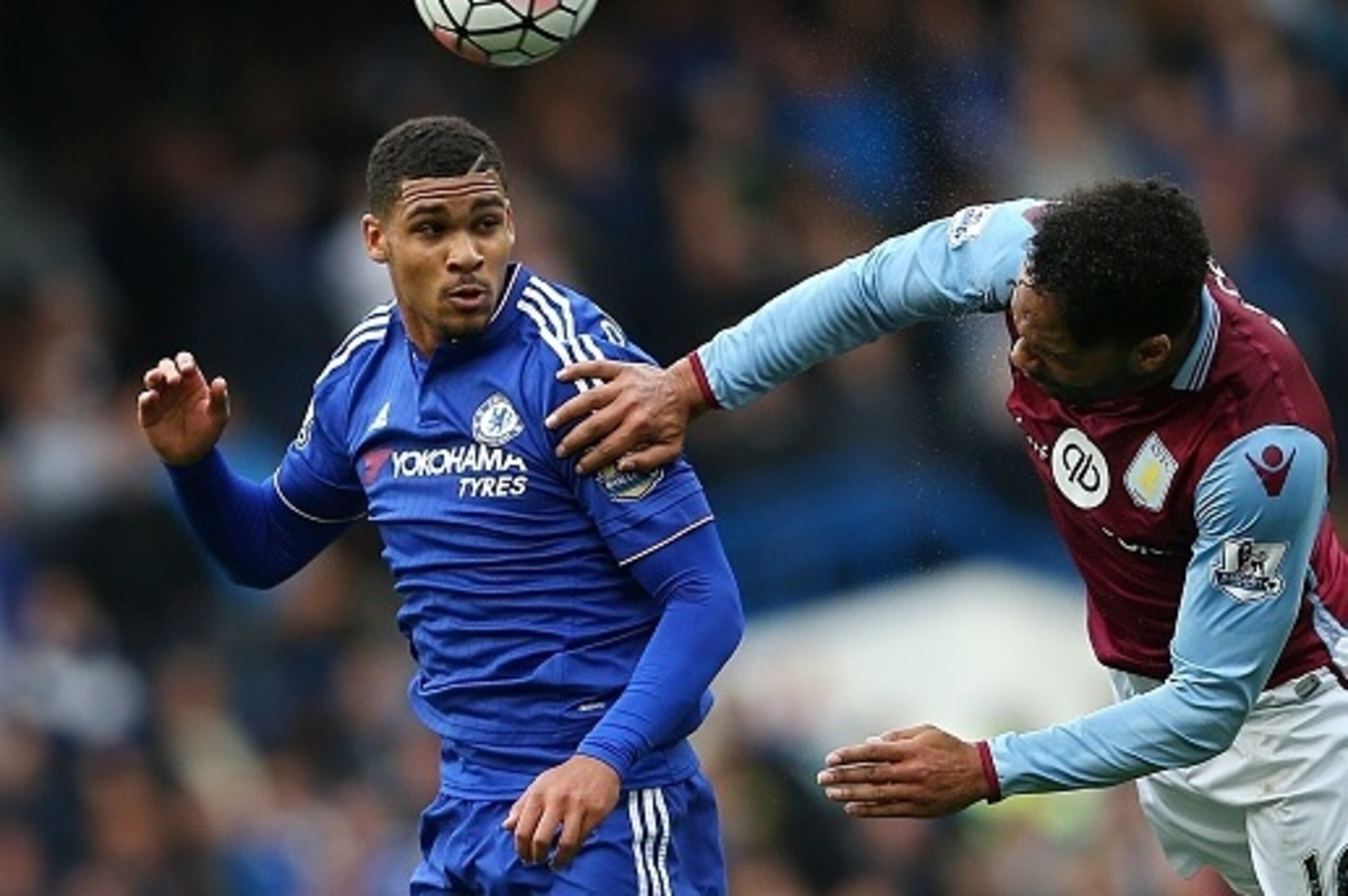 Aston Villa's English defender Joleon Lescott (R) vies for the ball against Chelsea's English midfielder Ruben Loftus-Cheek during the English Premier League football match between Chelsea and Aston Villa at Stamford Bridge in London on October 17, 2015. 