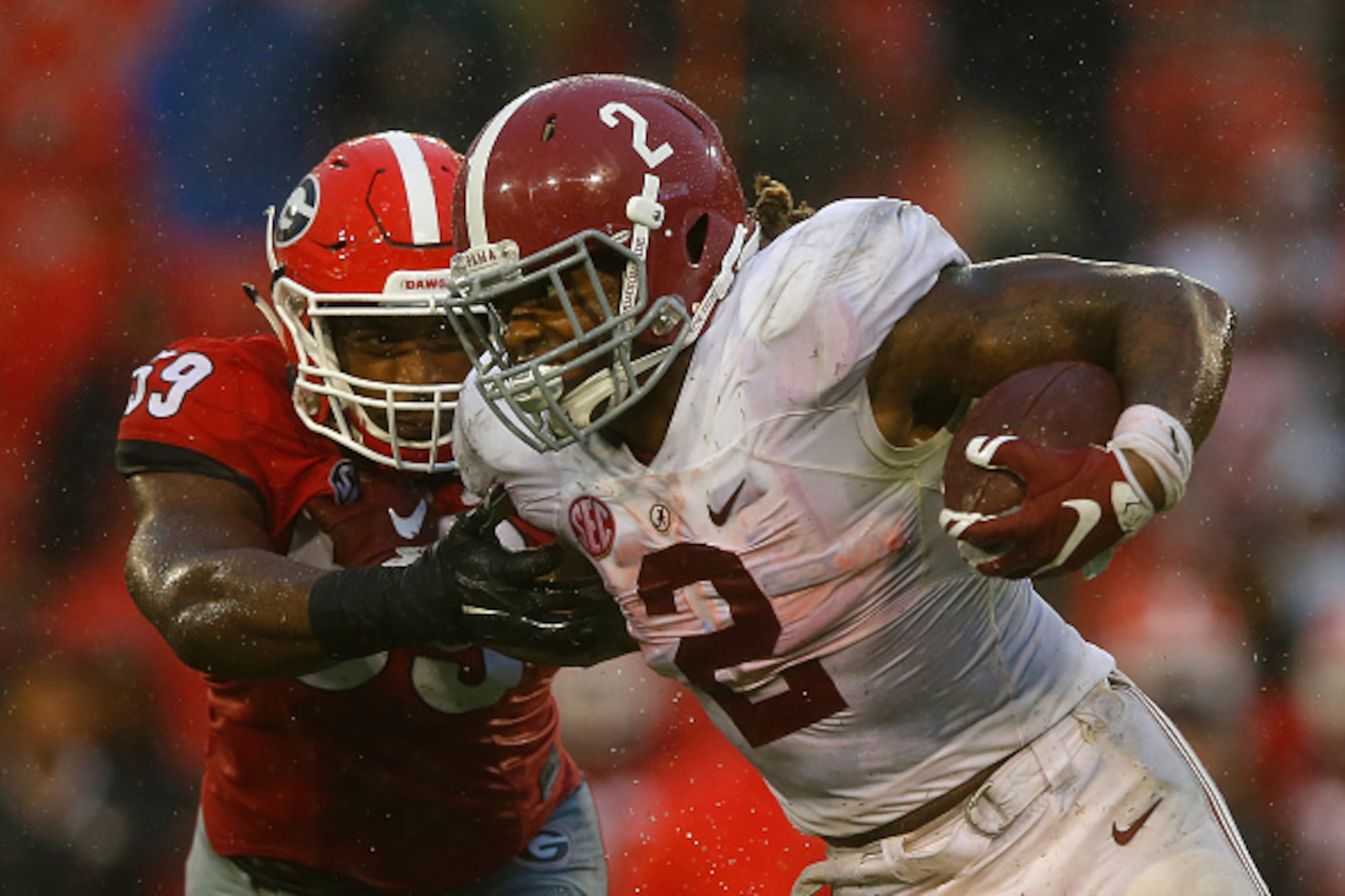 ATHENS, GA - OCTOBER 03:  Derrick Henry #2 of the Alabama Crimson Tide breaks a tackle by Jordan Jenkins #59 of the Georgia Bulldogs at Sanford Stadium on October 3, 2015 in Athens, Georgia.  (Photo by Kevin C. Cox/Getty Images)