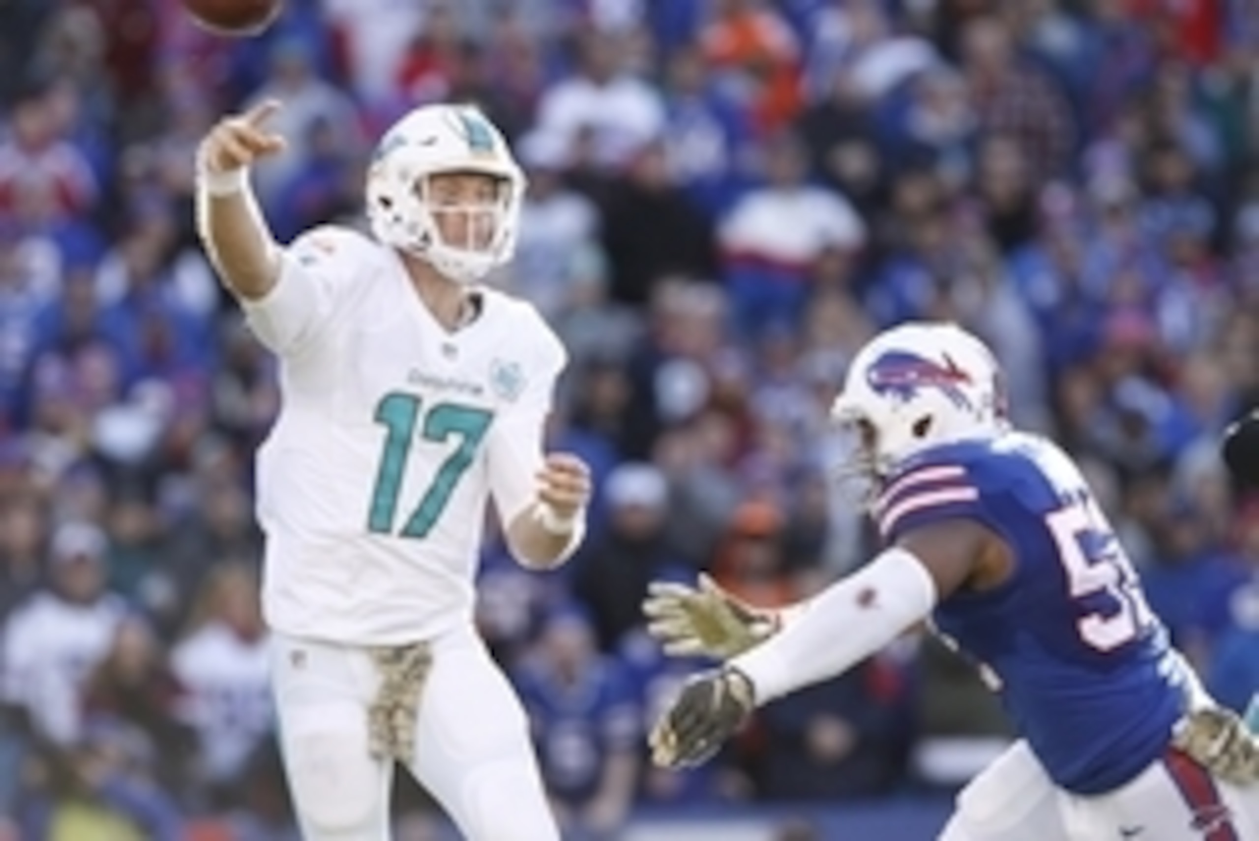 Nov 8, 2015; Orchard Park, NY, USA; Miami Dolphins quarterback Ryan Tannehill (17) throws a pass under pressure by Buffalo Bills outside linebacker Nigel Bradham (53) during the first half at Ralph Wilson Stadium. Mandatory Credit: Kevin Hoffman-USA TODAY