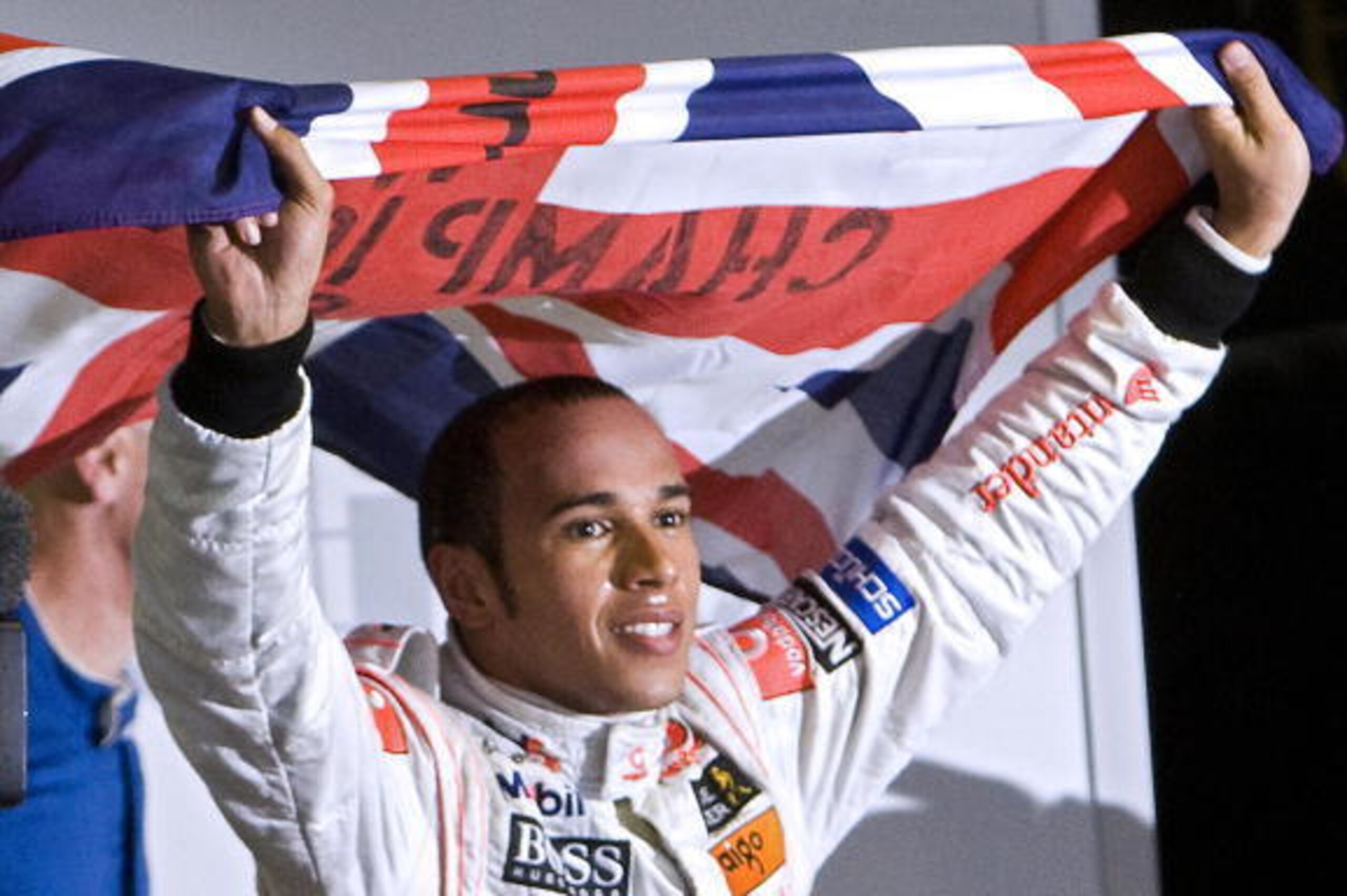 British Formula One driver Lewis Hamilton waves his national flag to celebrate after winning the F-1 World Championship on November 2, 2008, at Interlagos race track in Sao Paulo, Brazil. Hamilton was crowned Formula One champion after finishing fifth in 