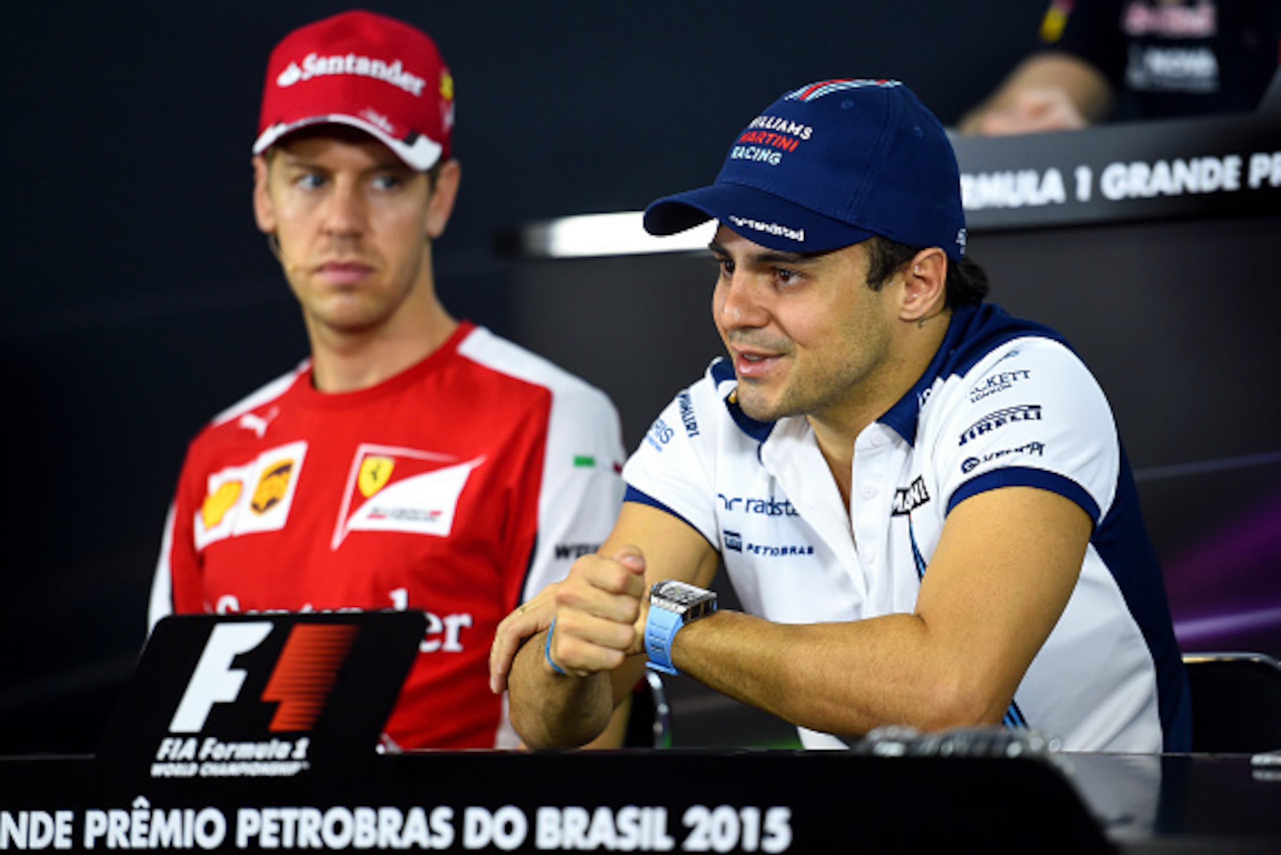 SAO PAULO, BRAZIL - NOVEMBER 12:  Sebastian Vettel of Germany and Ferrari and Felipe Massa of Brazil and Williams attend a press conference during previews for the Formula One Grand Prix of Brazil at Autodromo Jose Carlos Pace on November 12, 2015 in Sao 
