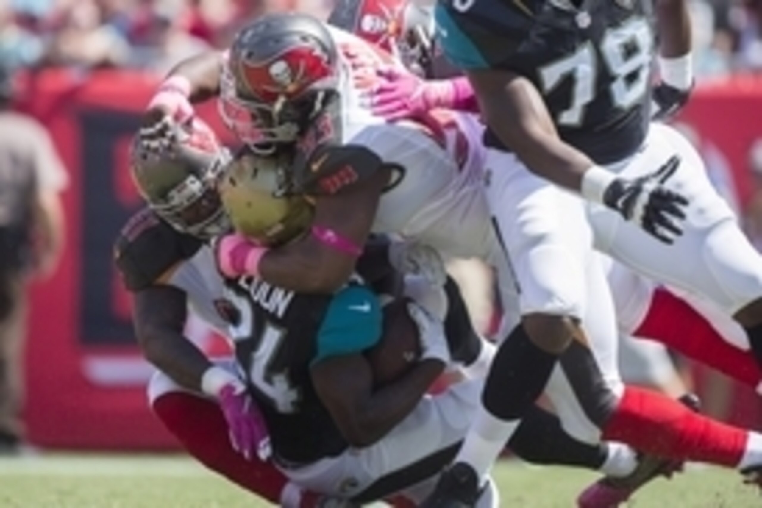 Oct 11, 2015; Tampa, FL, USA; Tampa Bay Buccaneers defensive tackle Gerald McCoy (93) and linebacker Danny Lansanah (51) tackle Jacksonville Jaguars running back T.J. Yeldon (24) in the first quarter at Raymond James Stadium. Mandatory Credit: Logan Bowle