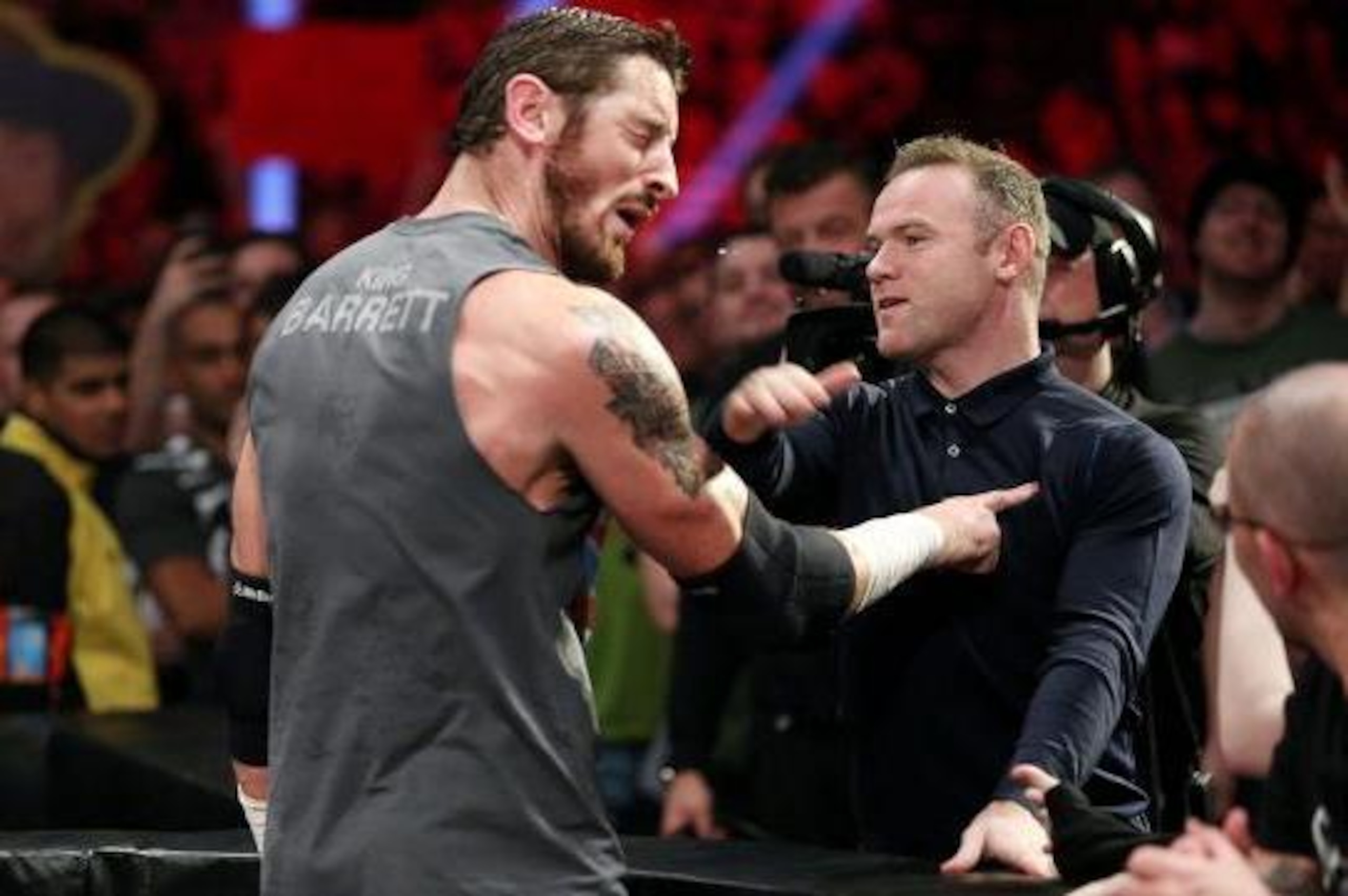 Wayne Rooney slaps King Barrett. Wayne Rooney slaps King Barrett.