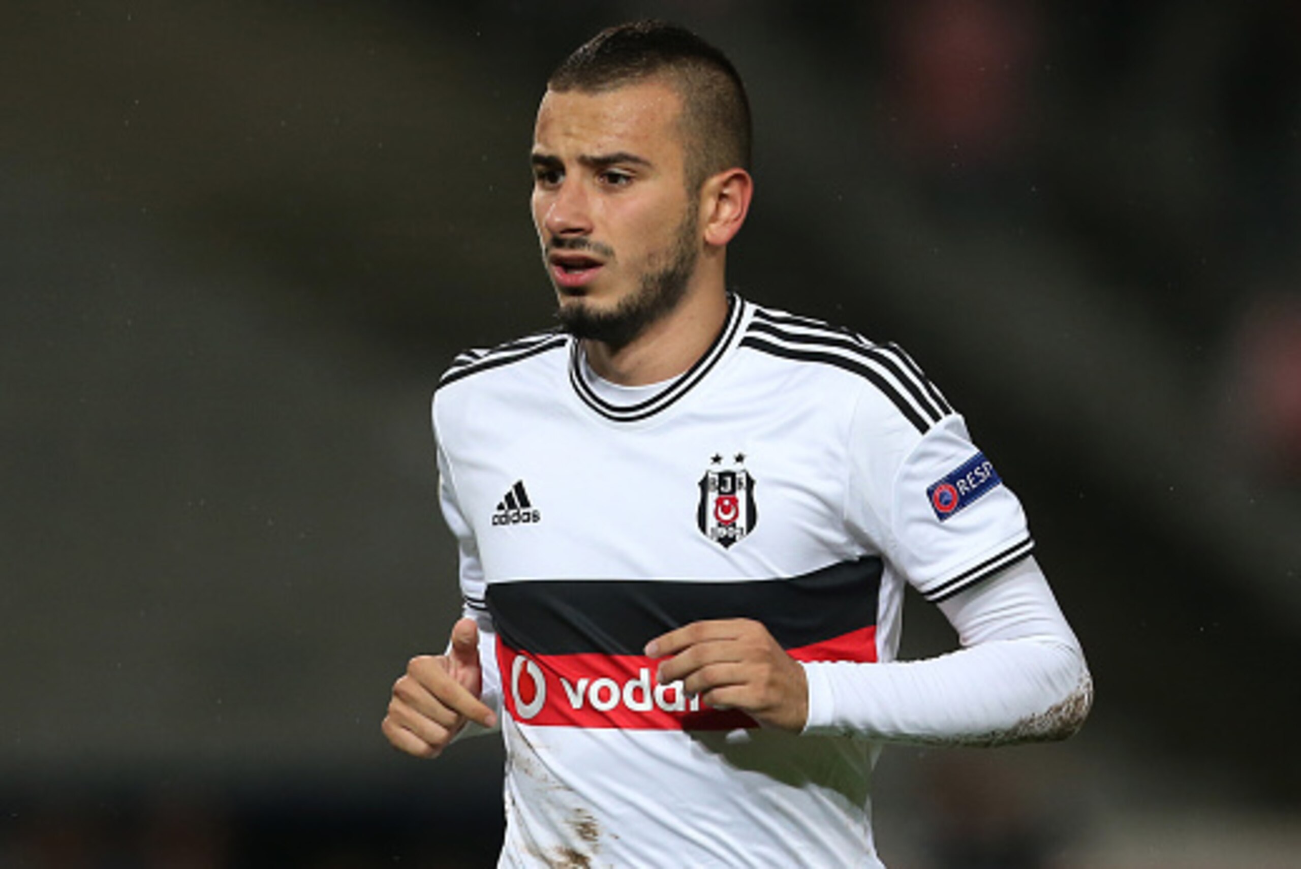 ISTANBUL, TURKEY -  SEPTEMBER 18: Oguzhan Ozyakup of Besiktas in action during the UEFA Europa League Group C match between Besiktas JK and Asteras Tripolis FC at the Ataturk Olympic Stadium in Istanbul, on September 18, 2014 in Istanbul,Turkey. (Photo by
