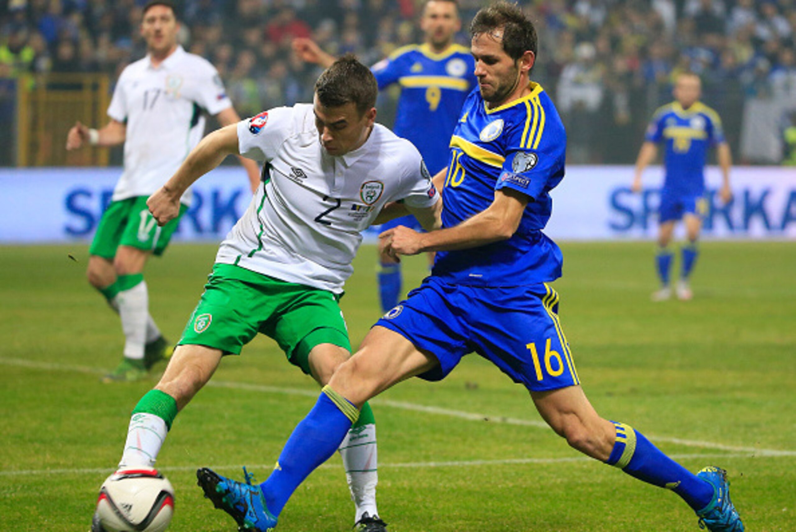 ZENICA, BOSNIA AND HERZEGOVINA - NOVEMBER 13. Seamus Coleman (L) of Ireland in action against Senad Lulic (R) of Bosnia during the EURO 2016 Qualifier Play-Off First Leg between Bosnia and Herzegovina and Republic of Ireland at Bilino Polje Stadium on Nov