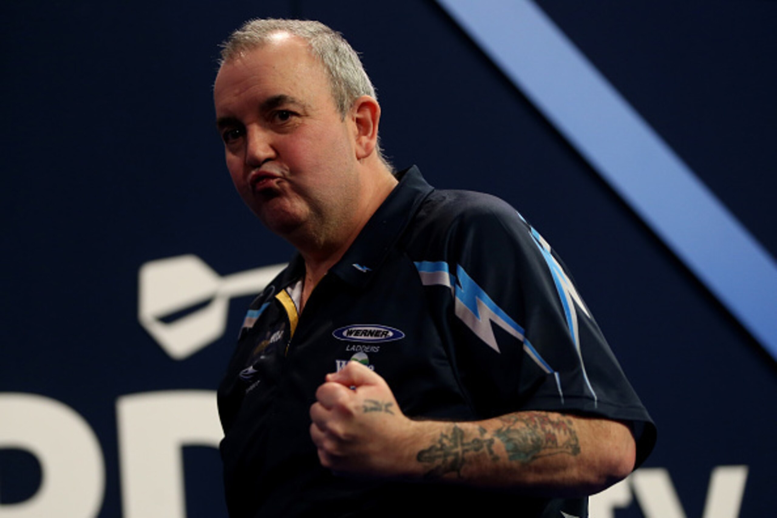 LONDON, ENGLAND - JANUARY 03:   Phil Taylor of England celebrates winning his semi final match against  Raymond van Barneveld of the Netherlands on day thirteen of the 2015 William Hill PDC World Darts Championships at Alexandra Palace on January 3, 2015 