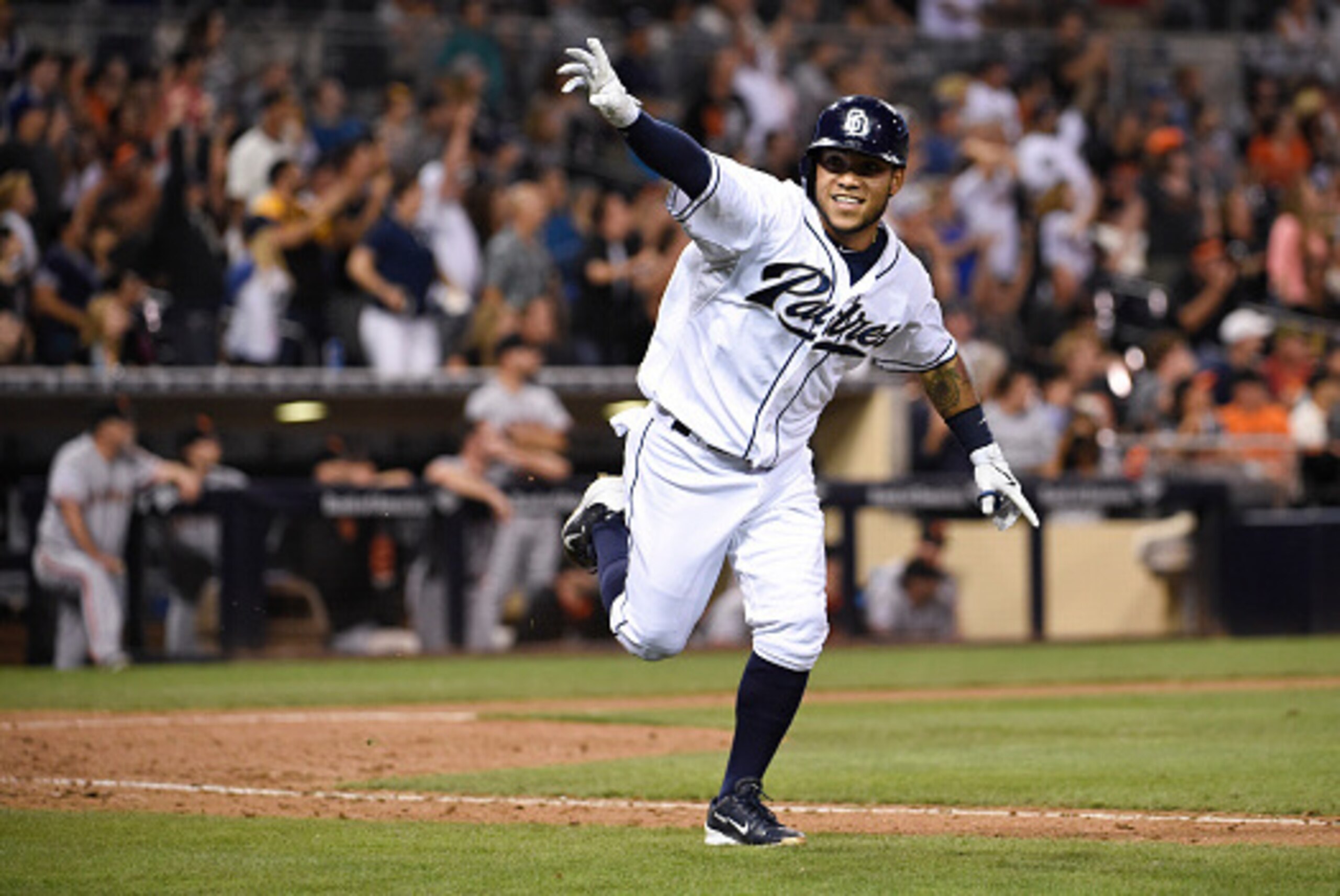 SAN DIEGO, CA - SEPTEMBER 24:  Alexi Amarista #5 of the San Diego Padres celebrates after hitting a walk-off single during the ninth inning of a baseball game against the San Francisco Giants at Petco Park September 24, 2015 in San Diego, California. The 