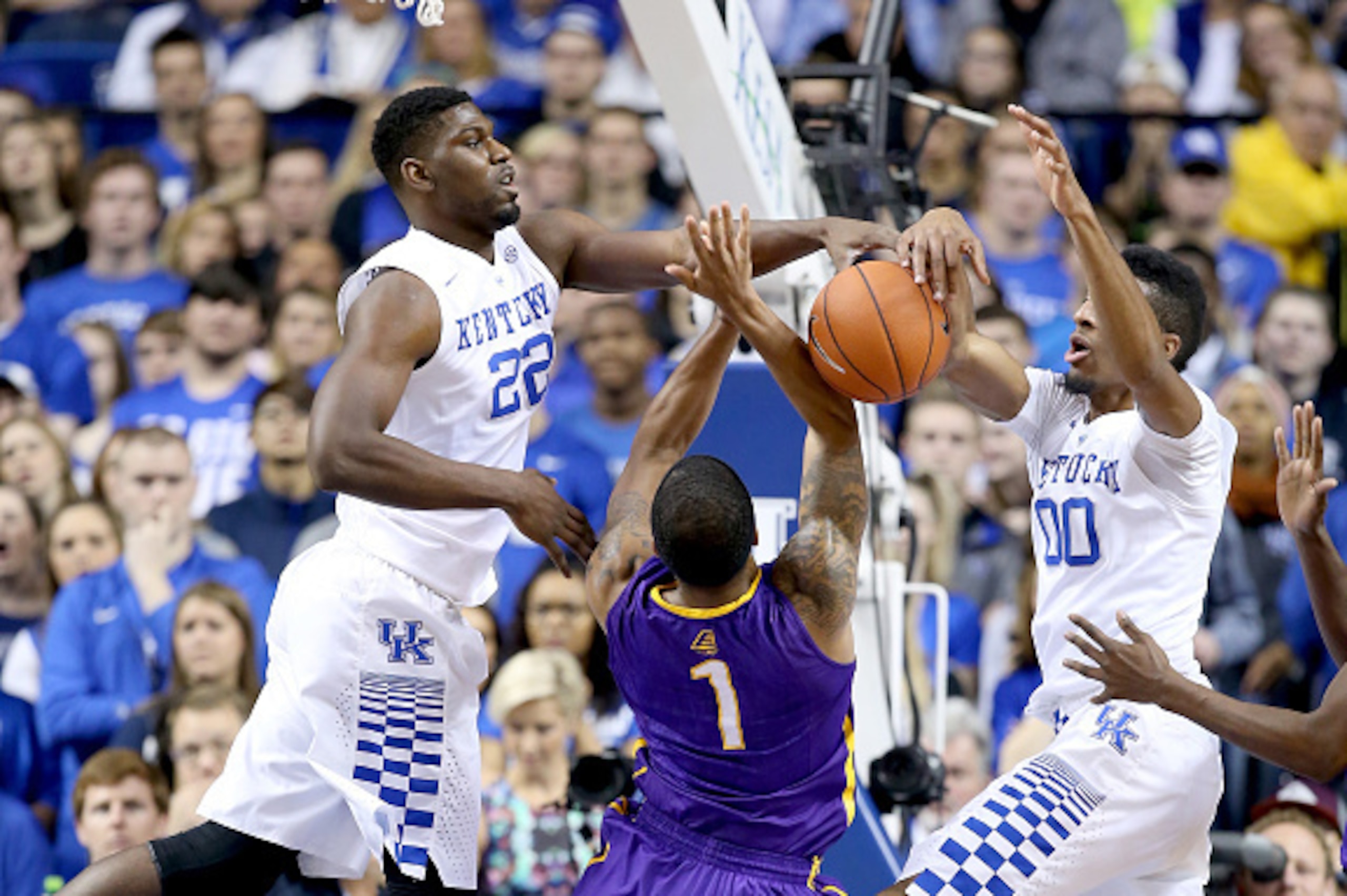 LEXINGTON, KY - NOVEMBER 13:  Alex Poythress #22 and Marcus Lee #00 of the Kentucky Wildcats defend the shot of Ray Sanders #1 of the Albany Great Danes at Rupp Arena on November 13, 2015 in Lexington, Kentucky.  (Photo by Andy Lyons/Getty Images)