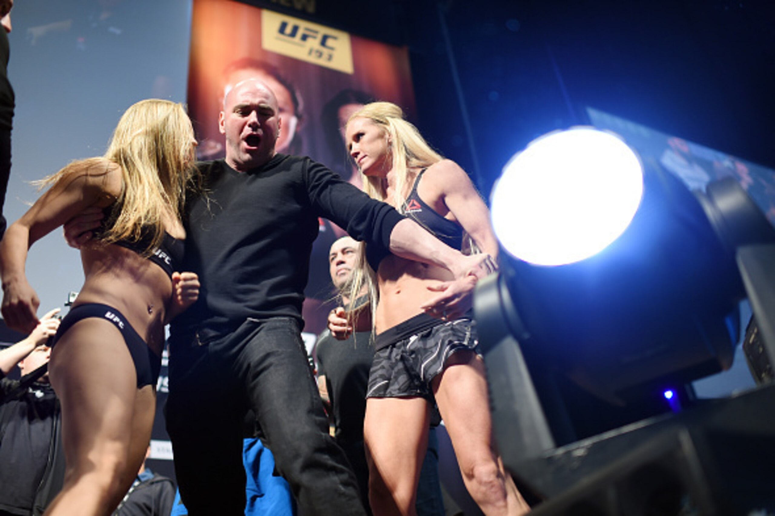 MELBOURNE, AUSTRALIA - NOVEMBER 14:  Ronda Rousey (L) and Holly Holm (R) are separated by UFC President Dana White onstage during the UFC 193 weigh-in at Etihad Stadium on November 14, 2015 in Melbourne, Australia. (Photo by Jeff Bottari/Zuffa LLC/Zuffa L