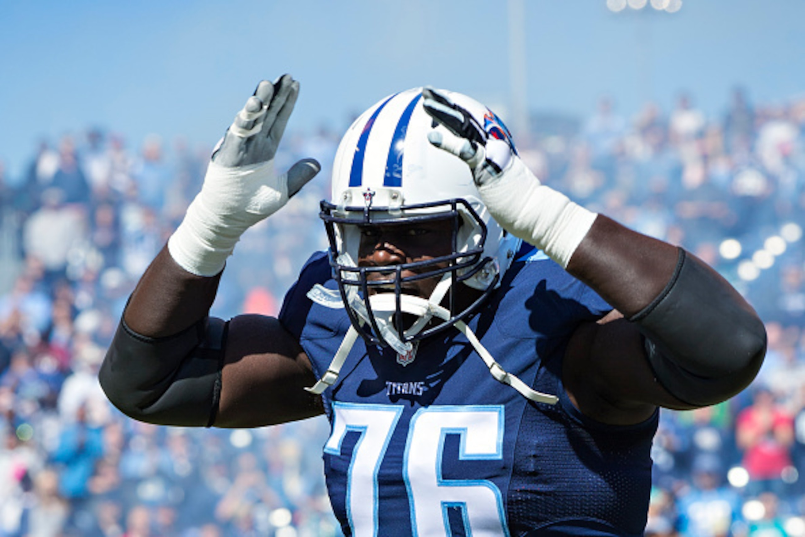 NASHVILLE, TN - OCTOBER 18:  Byron Bell #76 of the Tennessee Titans runs onto the field before a game against the Miami Dolphins at LP Field on October 18, 2015 in Nashville, Tennessee.  The Dolphins defeated the Titans 38-10.  (Photo by Wesley Hitt/Getty