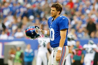 EAST RUTHERFORD, NJ - OCTOBER 06:  (NEW YORK DAILIES OUT)    Eli Manning #10 of the New York Giants looks on after throwing an interception in the second half against the Philadelphia Eagles on October 6, 2013 at MetLife Stadium in East Rutherford, New Je