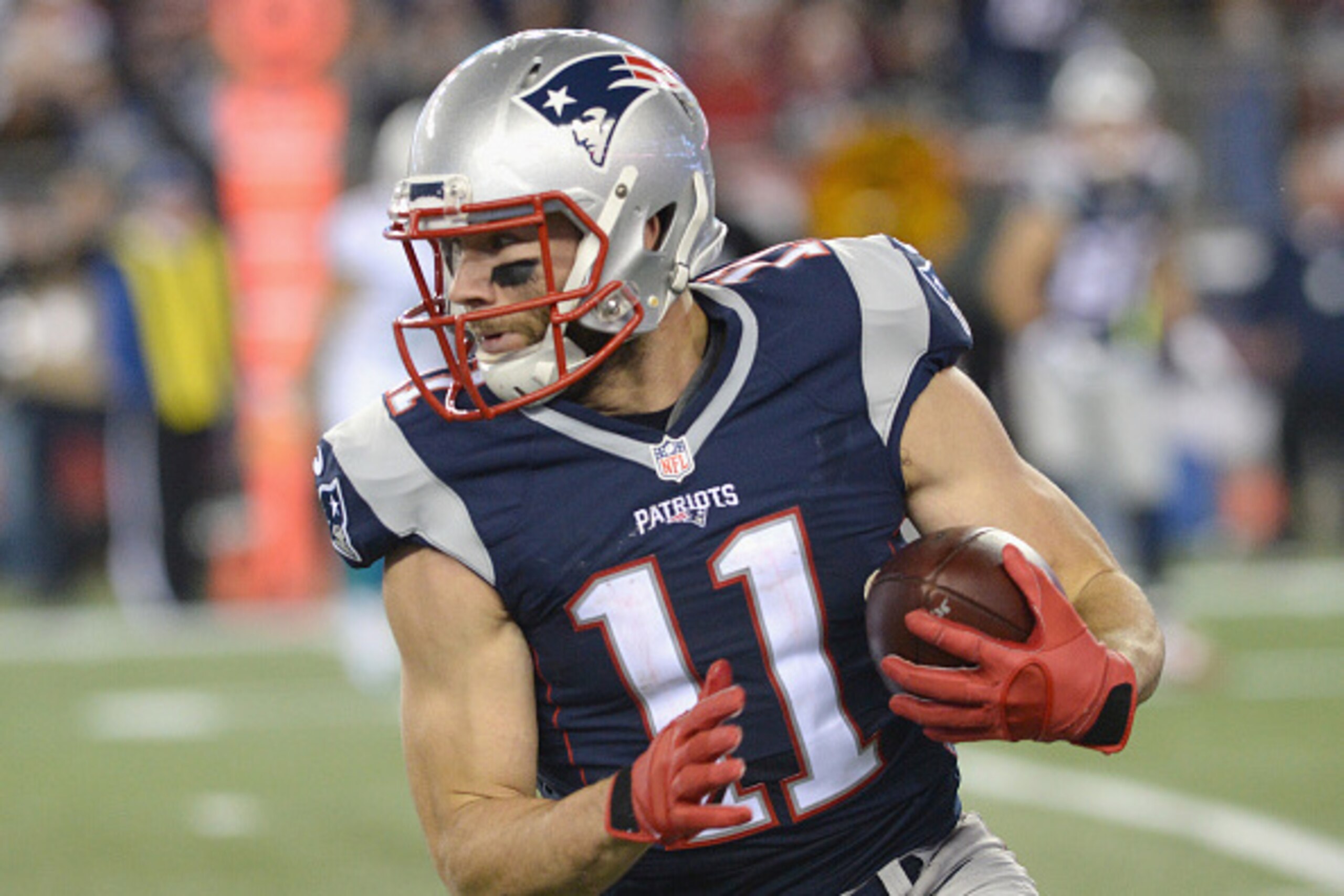 FOXBORO, MA - OCTOBER 29:  Julian Edelman #11 of the New England Patriots  carries the ball after a catch during the first quarter against the Miami Dolphins at Gillette Stadium on October 29, 2015 in Foxboro, Massachusetts.  (Photo by Darren McCollester/