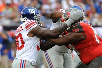 TAMPA, FL - NOVEMBER 8: Defensive tackle #90 Jason Pierre-Paul rushes offensive tackle Donovan Smith #76 of the Tampa Bay Buccaneers in the first quarter at Raymond James Stadium on November 8, 2015 in Tampa, Florida. (Photo by Cliff McBride/Getty Images)