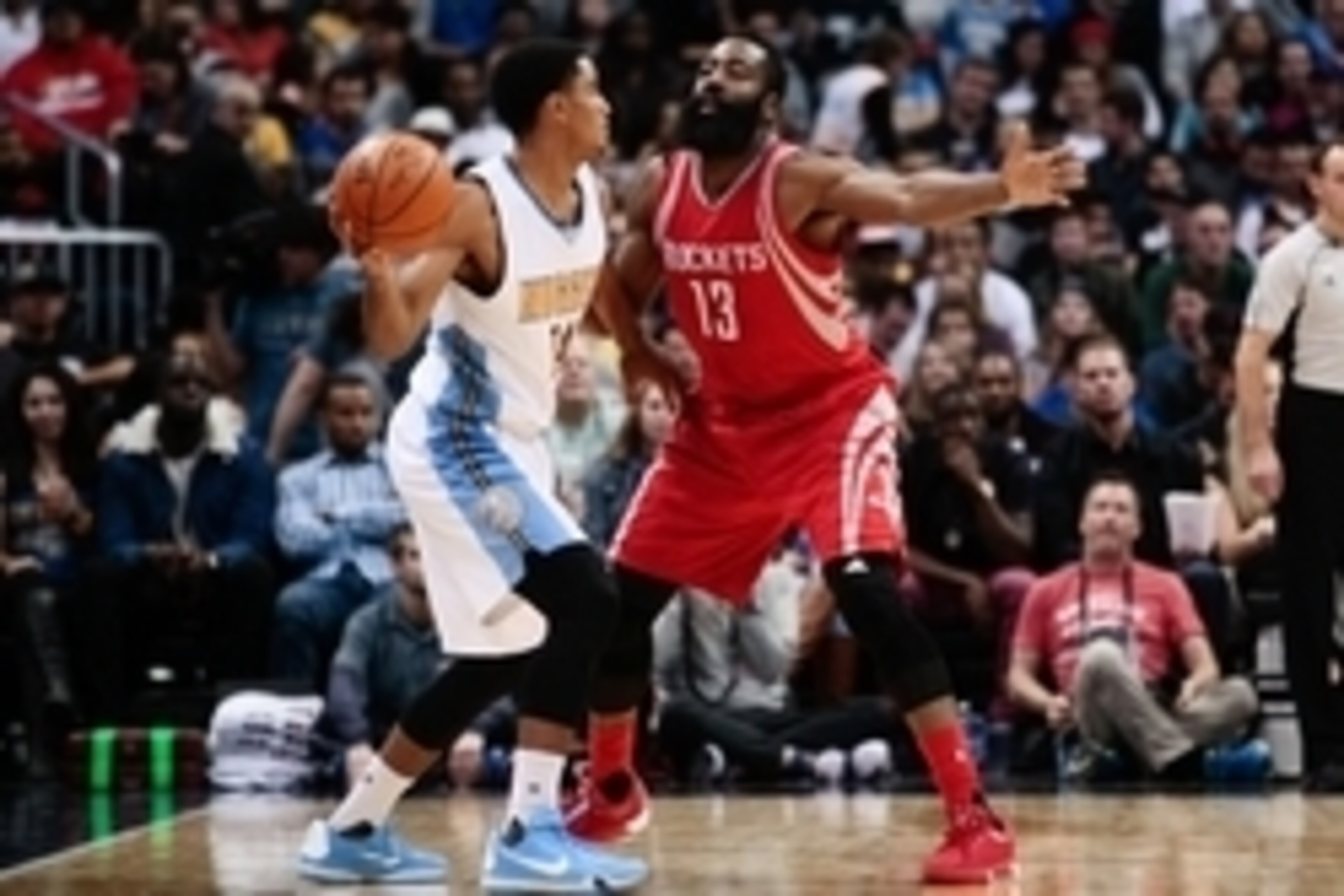 Nov 13, 2015; Denver, CO, USA; Houston Rockets guard James Harden (13) guards Denver Nuggets guard Gary Harris (14) in the third quarter at the Pepsi Center. Mandatory Credit: Isaiah J. Downing-USA TODAY Sports