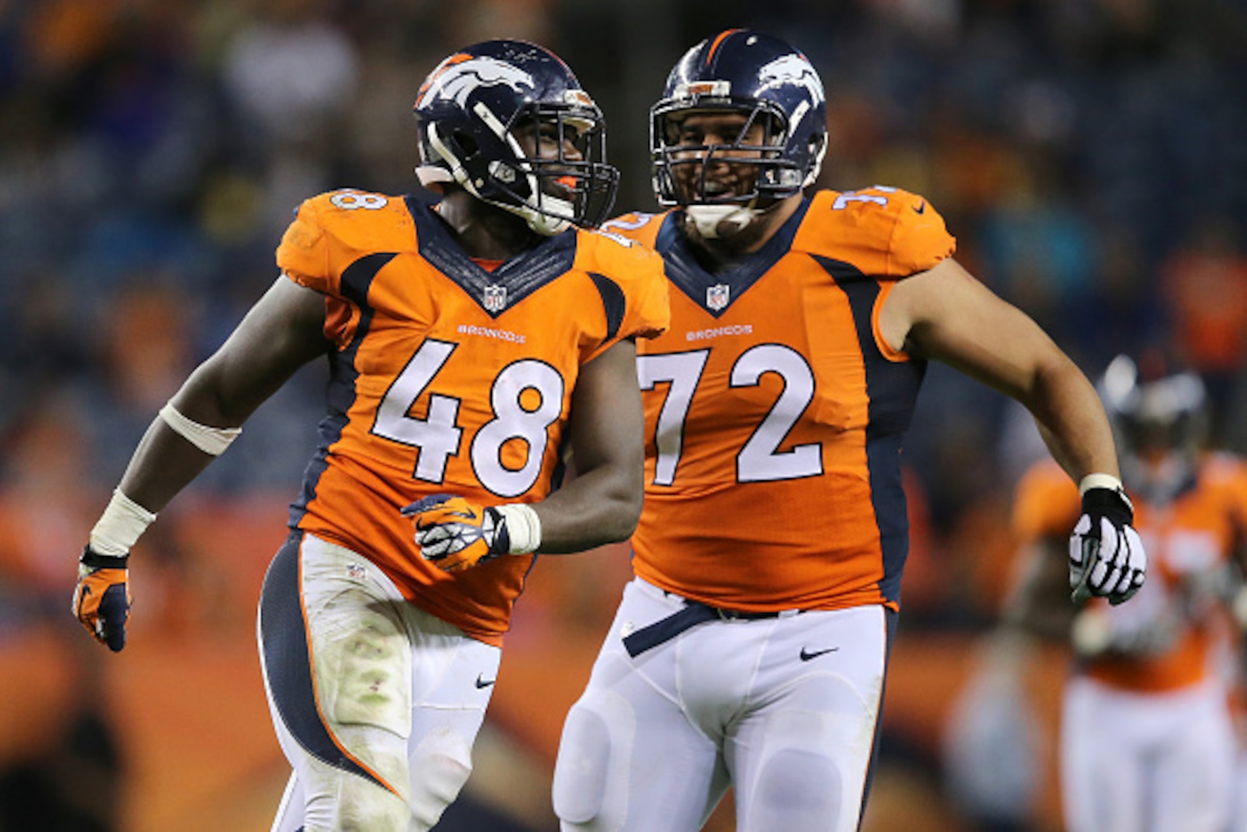 DENVER, CO - SEPTEMBER 03:  Shaquil Barrett #48 of the Denver Broncos celebrates a sack against the Arizona Cardinals with teammate Sione Fua #72 during preseason action at Sports Authority Field at Mile High on September 3, 2015 in Denver, Colorado. The 