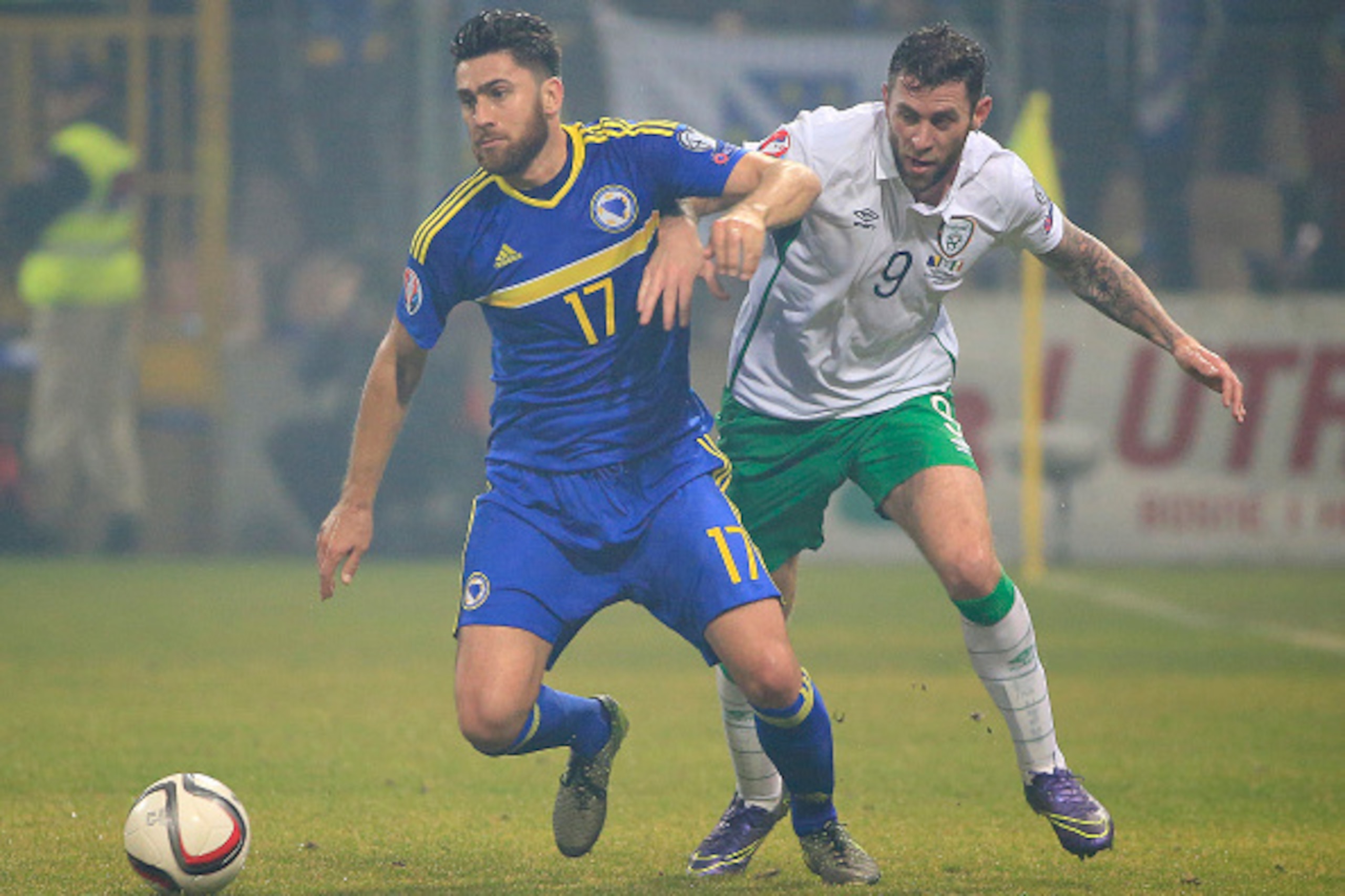 ZENICA, BOSNIA AND HERZEGOVINA - NOVEMBER 13. Ervin Zukanovic (L) of Bosnia in action against Daryl Murphy (R) during the EURO 2016 Qualifier Play-Off First Leg match at Bilino Polje Stadium on November 13, 2015 in Zenica, Bosnia and Herzegovina. (Photo b