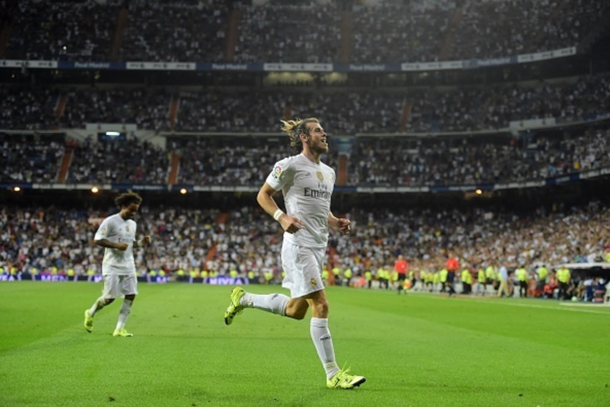 Real Madrid's Welsh forward Gareth Bale celebrates after scoring his second goal during the Spanish league football match Real Madrid CF vs Real Betis Balompie at the Santiago Bernabeu stadium in Madrid on August 29, 2015. AFP PHOTO/ PIERRE-PHILIPPE MAR Real Madrid's Welsh forward Gareth Bale celebrates after scoring his second goal during the Spanish league football match Real Madrid CF vs Real Betis Balompie at the Santiago Bernabeu stadium in Madrid on August 29, 2015. AFP PHOTO/ PIERRE-PHILIPPE MAR