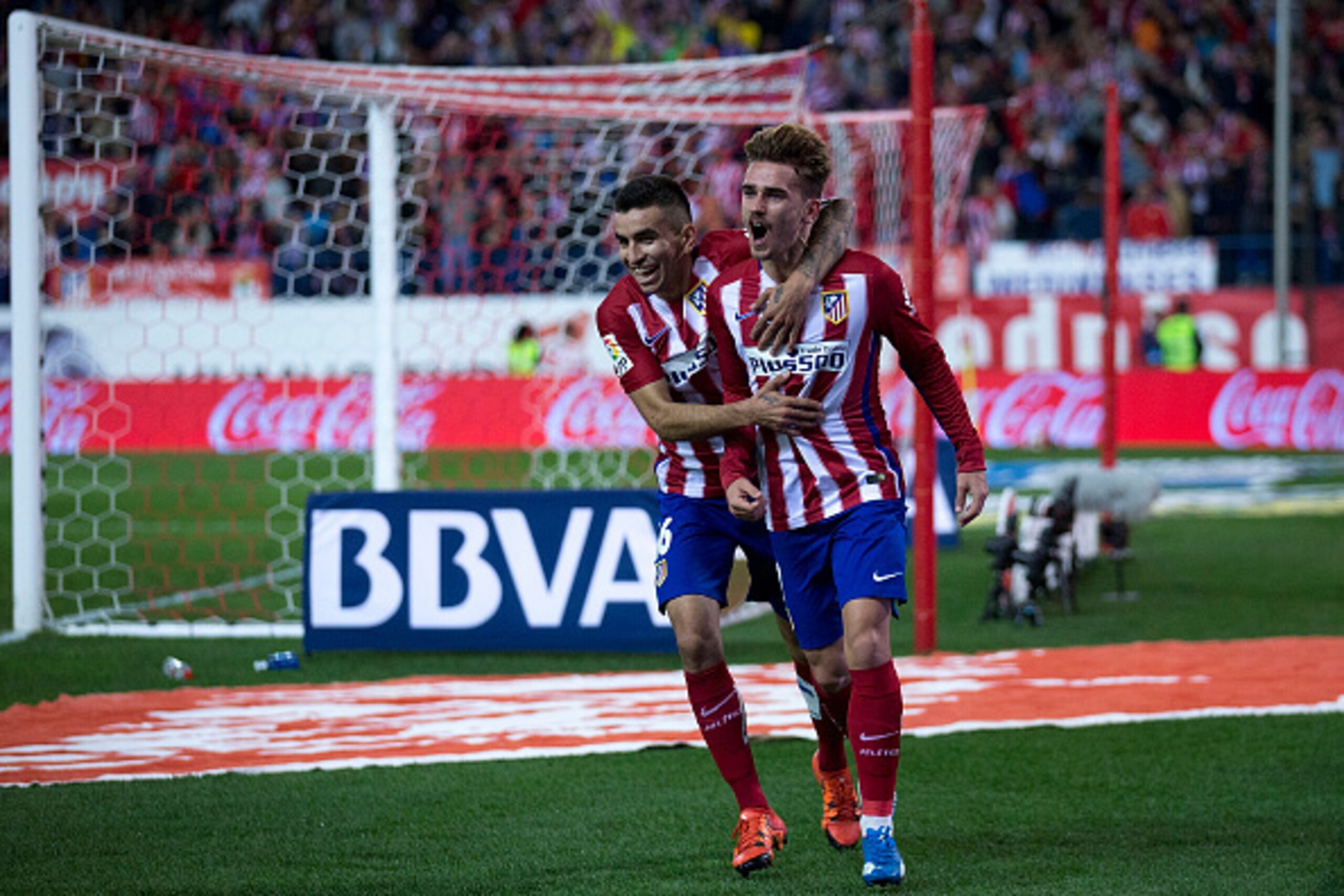 MADRID, SPAIN - NOVEMBER 08: Antoine Griezmann (R) of Atletico de Madrid celebrates scoring their opening goal with teammate Angel Martin Correa (L) during the La Liga mathc bewteen Club Atletico de Madrid and Real Sporting de Gijon at Vicente Calderon S MADRID, SPAIN - NOVEMBER 08: Antoine Griezmann (R) of Atletico de Madrid celebrates scoring their opening goal with teammate Angel Martin Correa (L) during the La Liga mathc bewteen Club Atletico de Madrid and Real Sporting de Gijon at Vicente Calderon S