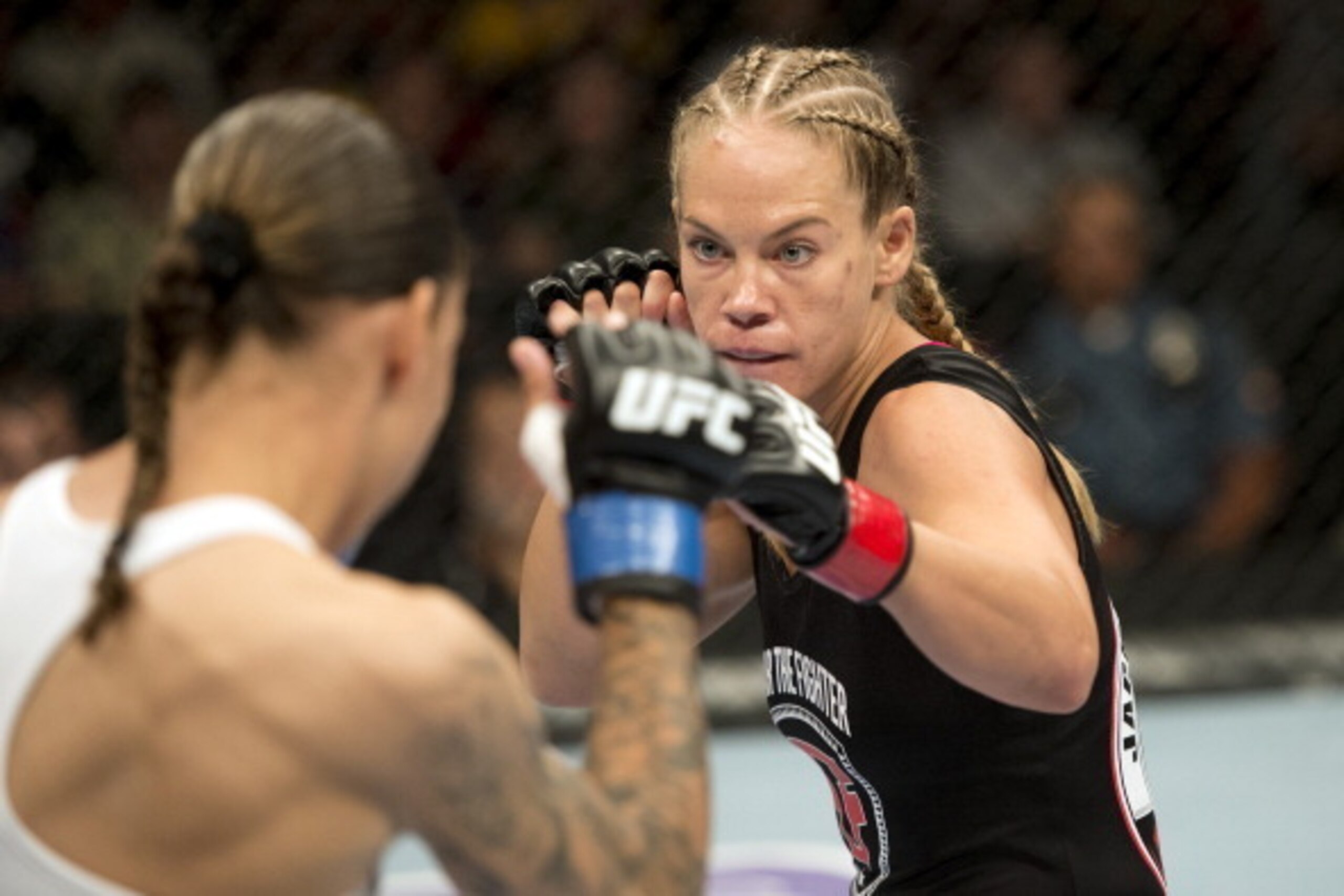 SEATTLE, WA - JULY 27:  (R-L) Julie Kedzie looks to strike against Germaine de Randamie in their bantamweight bout during the UFC on FOX event at Key Arena on July 27, 2013 in Seattle, Washington. (Photo by Jeff Bottari/Zuffa LLC/Zuffa LLC via Getty Image